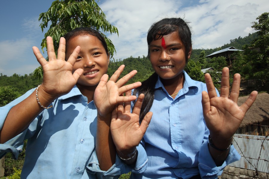 Girls wash their hands at a water source at a NEWAH WASH water project in Puware Shikhar, Udayapur District, Nepal. (10698175334)