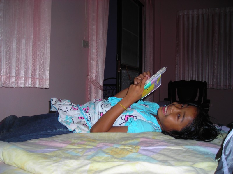 Thai girl reading a book