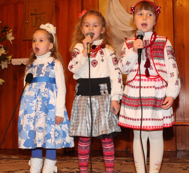 three cute child girls performing in a Church in a Catholic kindergarten, photo 2