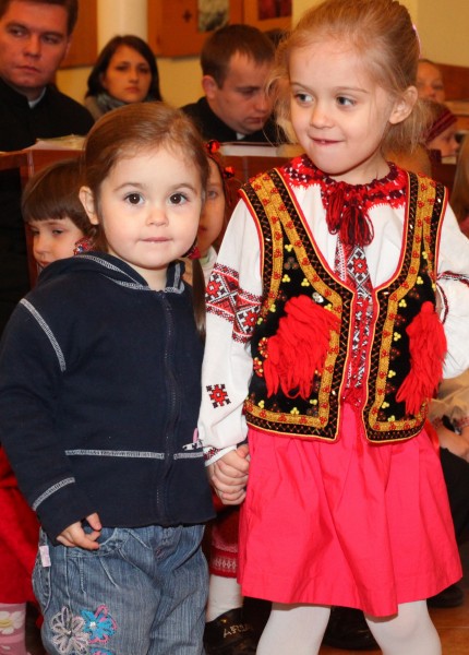 two cute charming beautiful Catholic child girls in a Church, photo 2