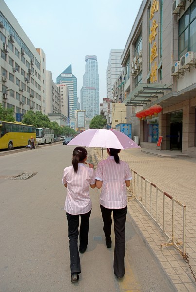 Two girls under an umbrella