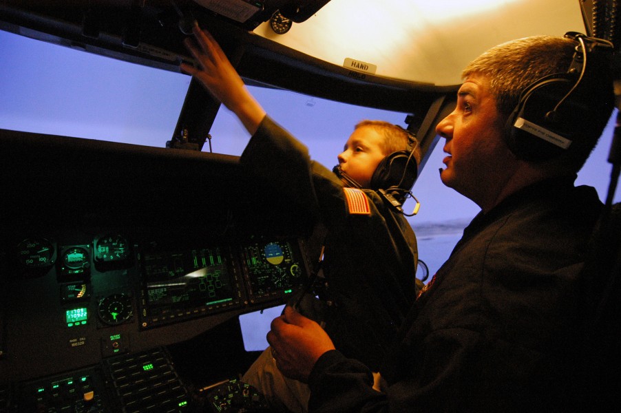 US Navy 071004-N-2183K-212 Father and son, fly an MH-60S Seahawk helicopter in a flight simulator at Helicopter Sea Combat Squadron (HSC) 23, on board Naval Air Station North Island