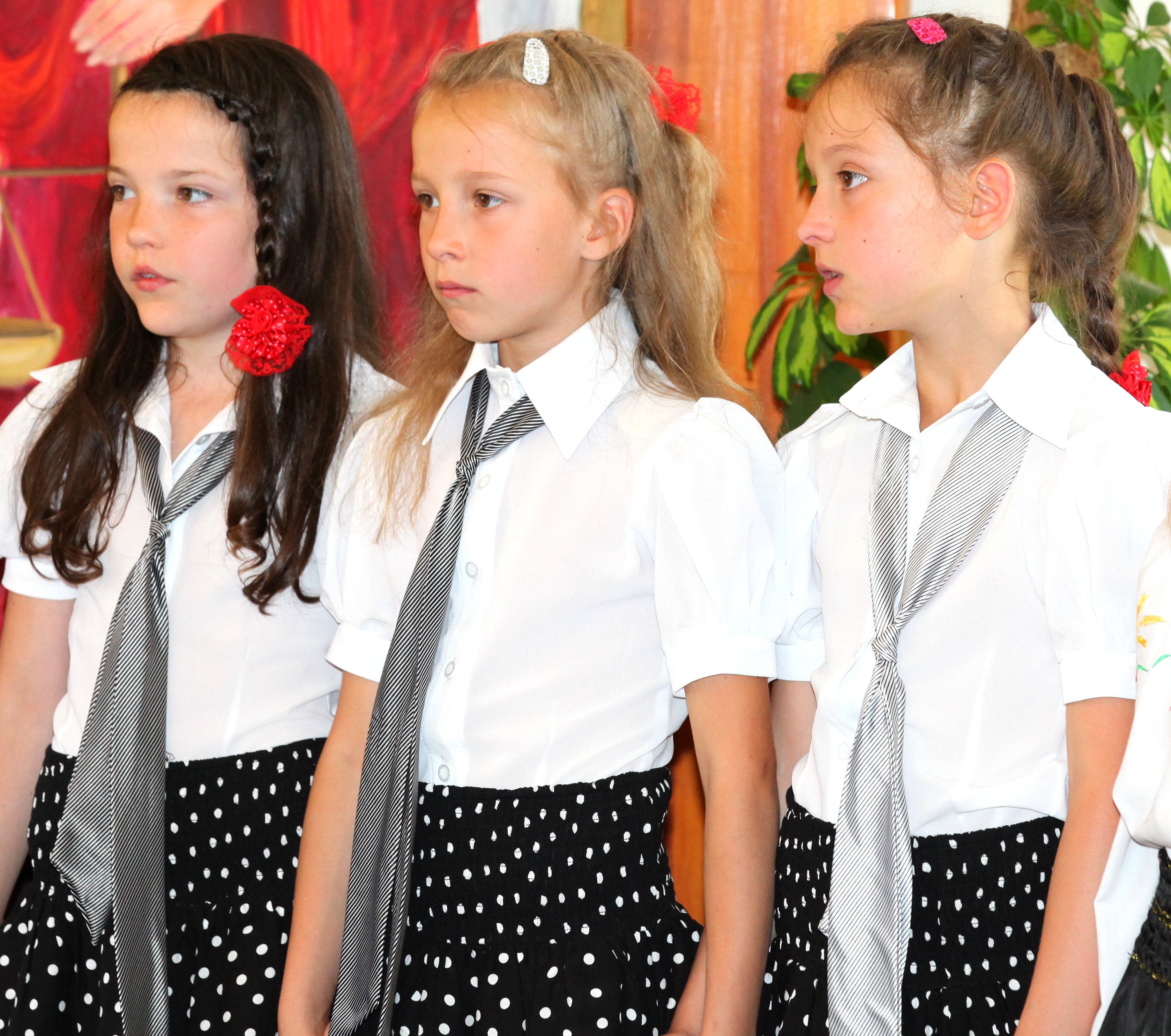 three young sisters in a Catholic church in July 2013