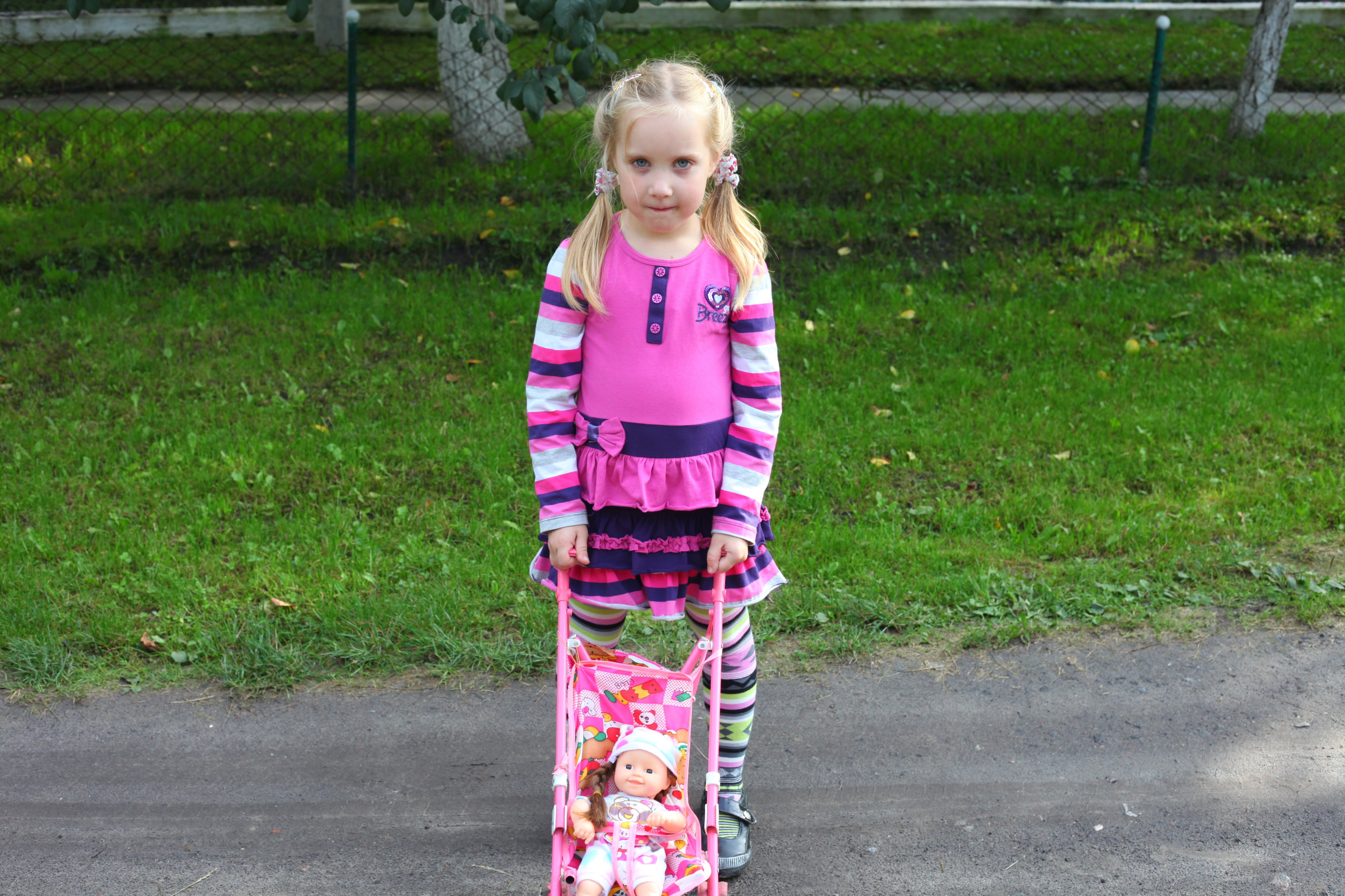 A child girl with a doll