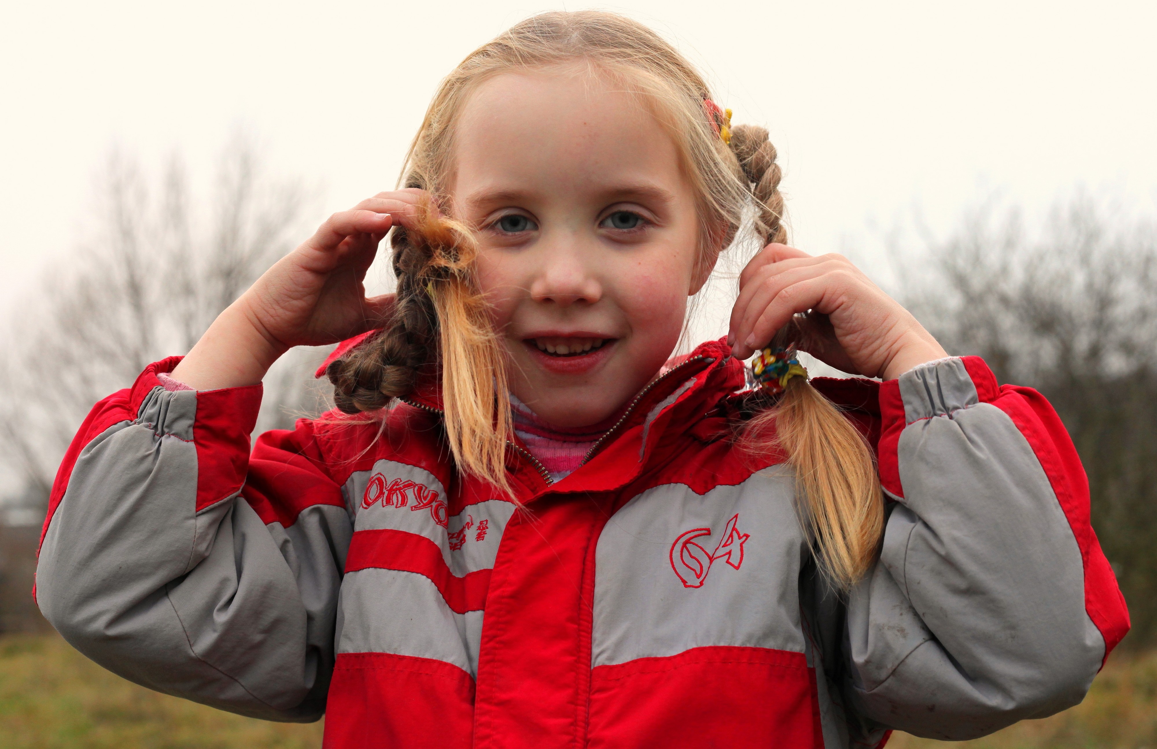 a cute blond 6-year-old Catholic girl with pigtails, picture 1