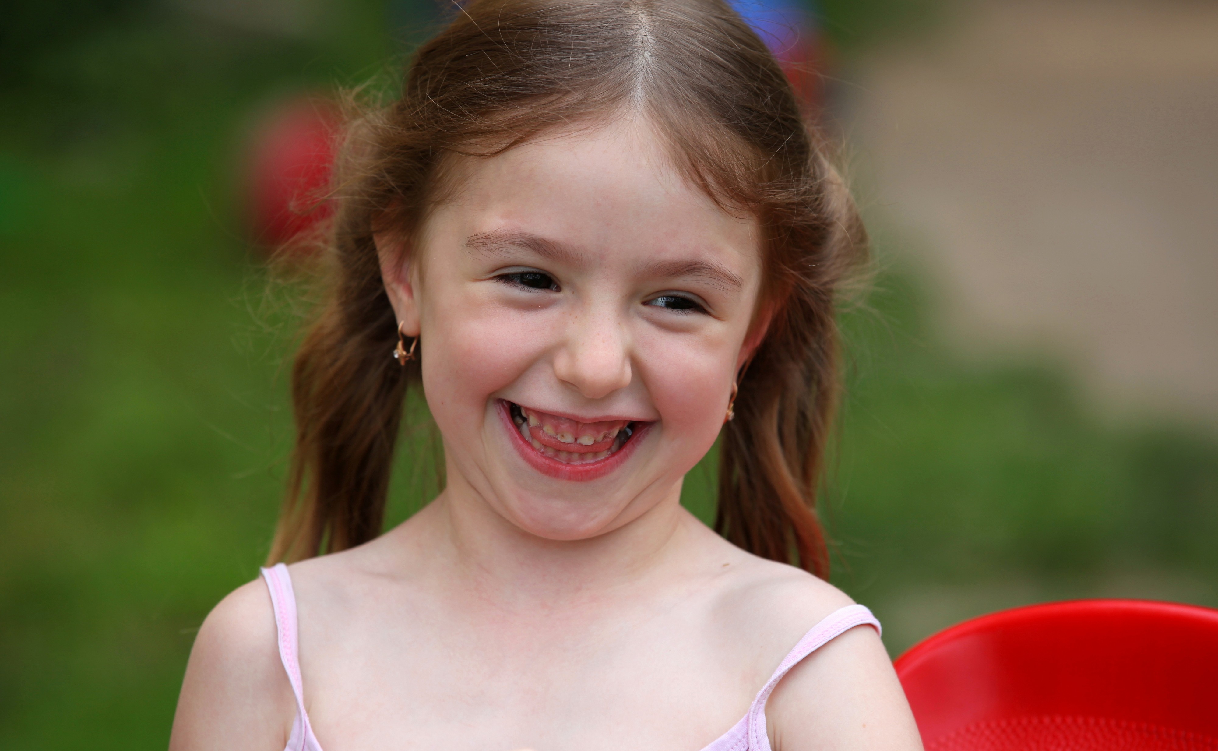 a cute smiling brunette child girl in a Christian camp in July 2013, portrait 1/7