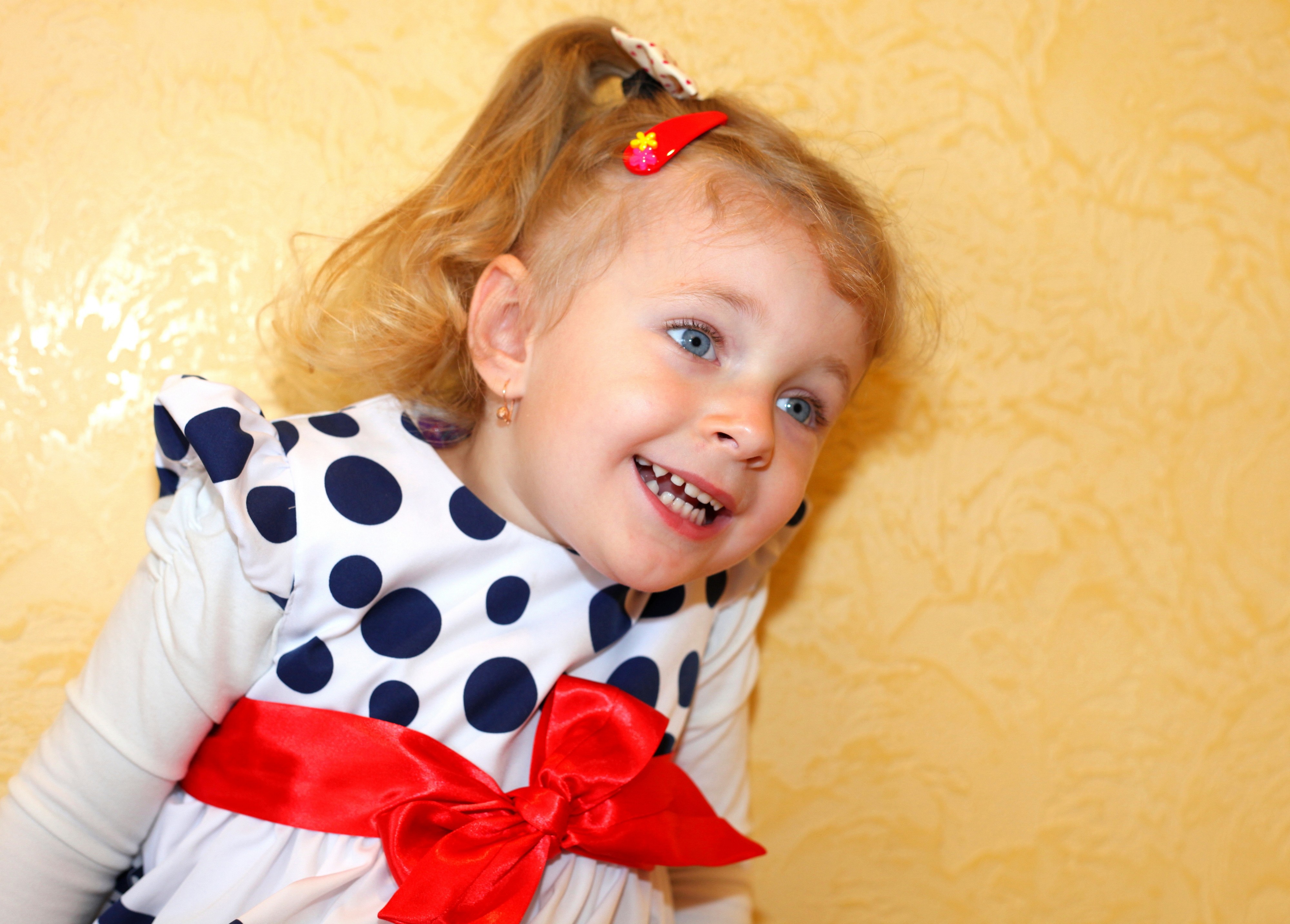 a three year old girl on her birthday in June 2013