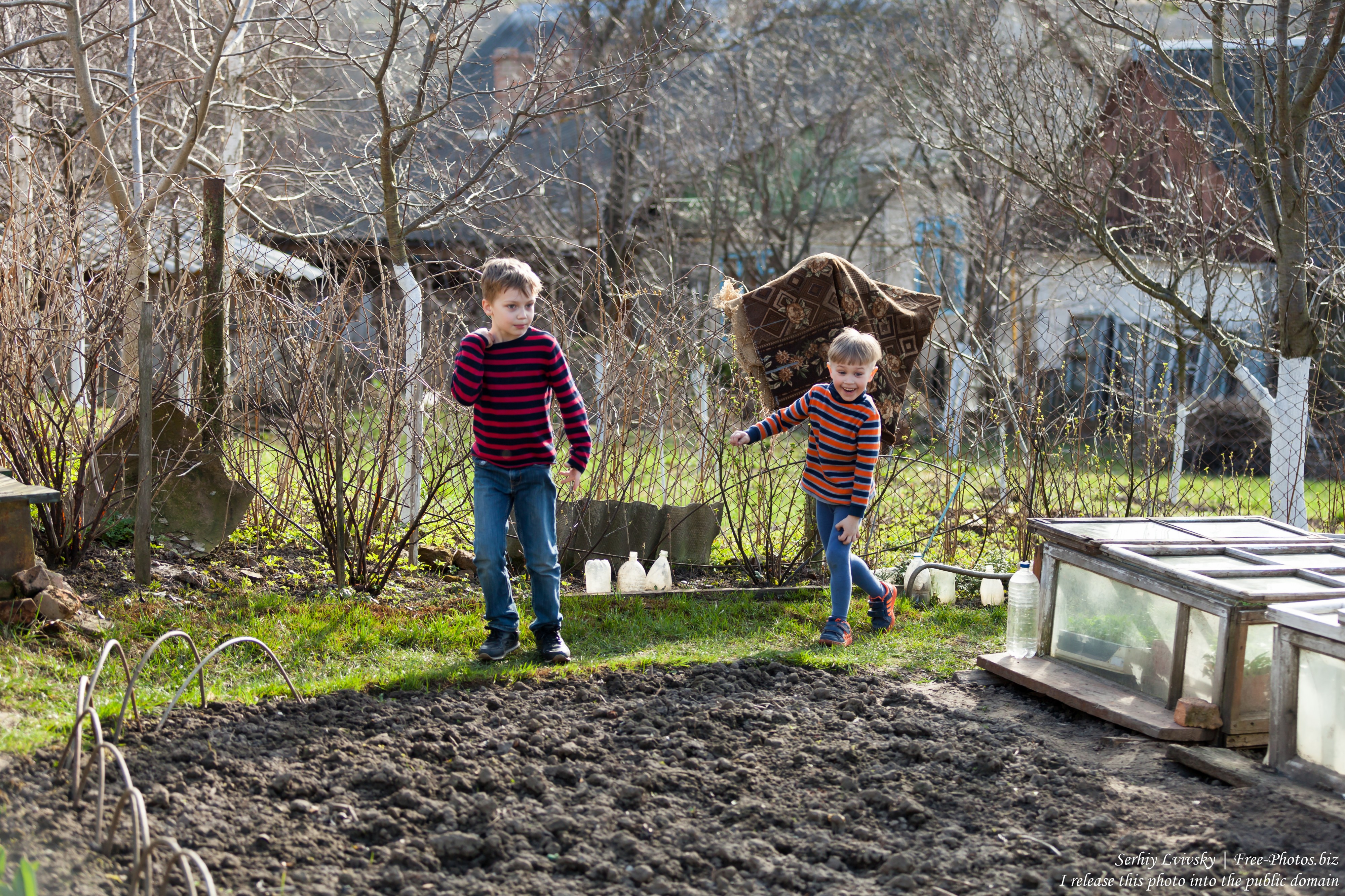 children in a garden in April 2018 photographed by Serhiy Lvivsky