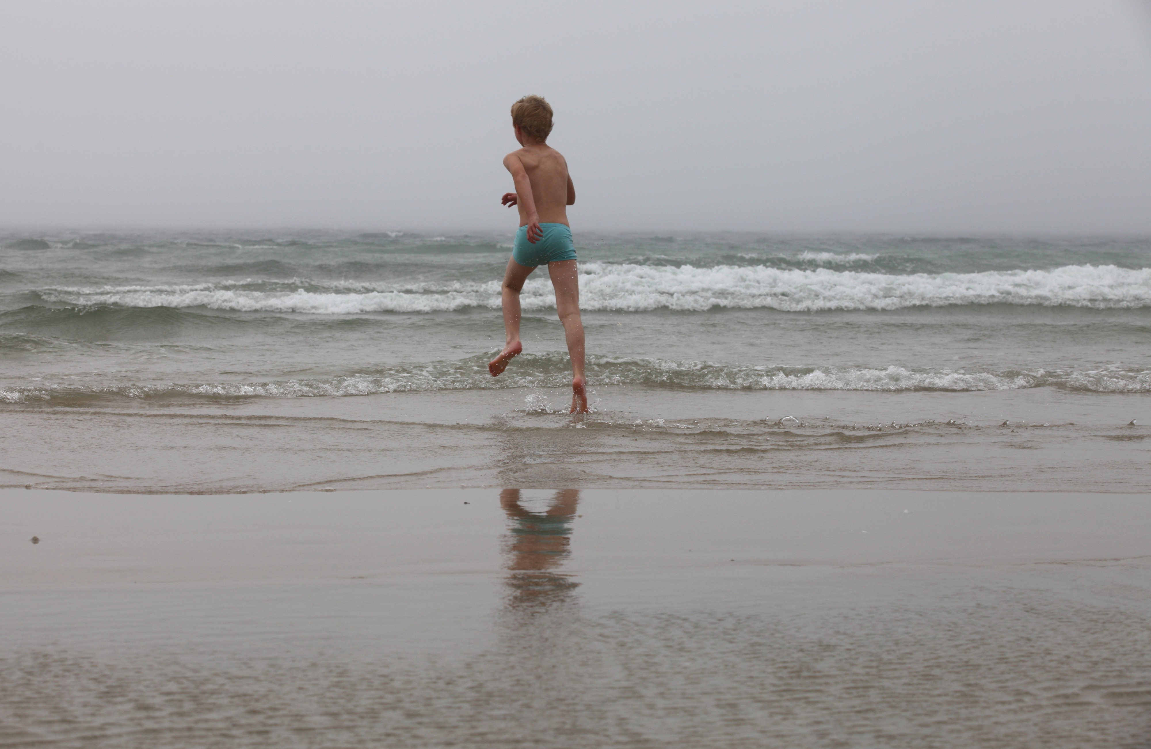 a boy running into the Atlantic ocean, near Fisterra, Spain, August 2013, picture 11