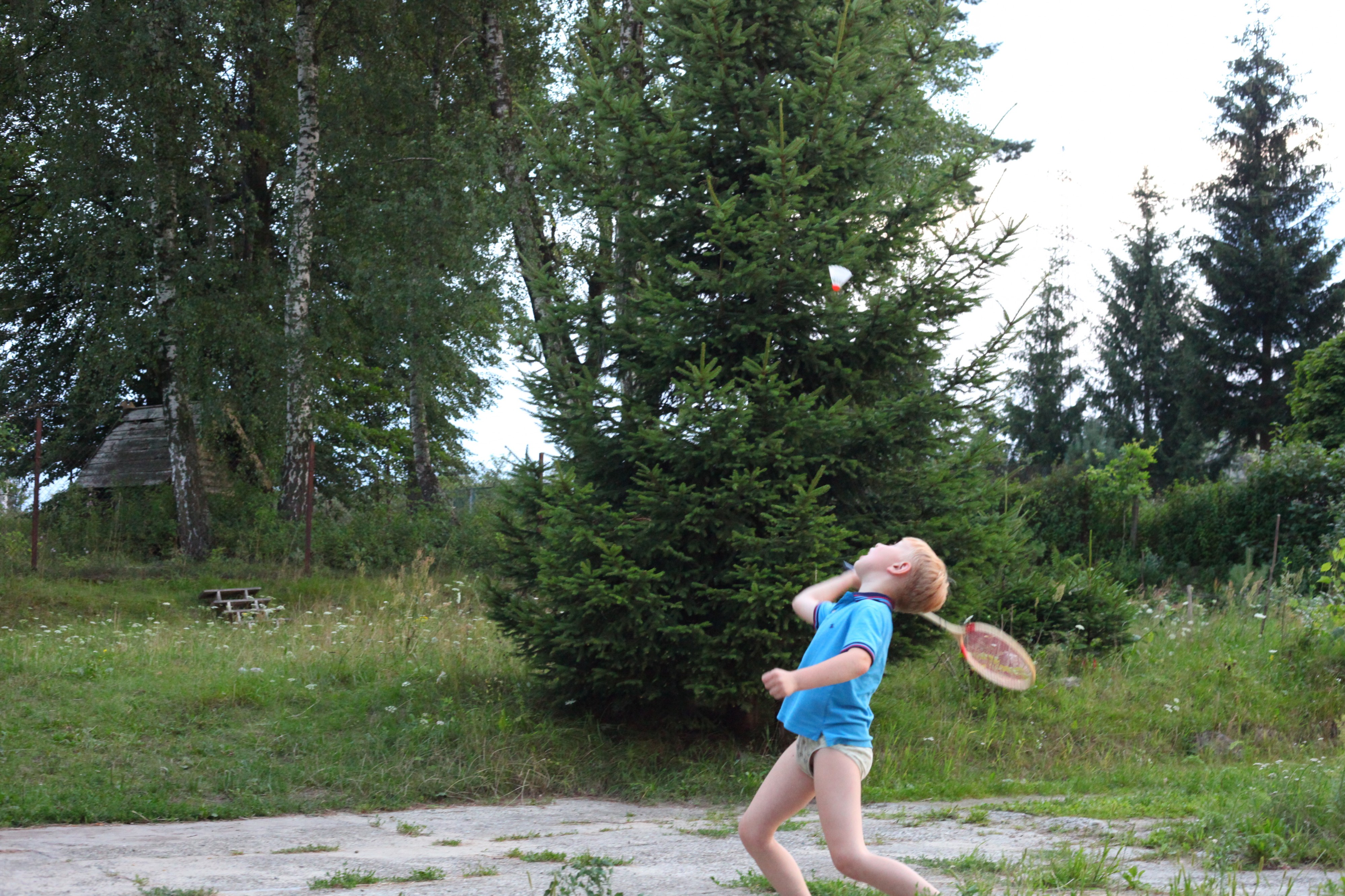 A boy playing badminton