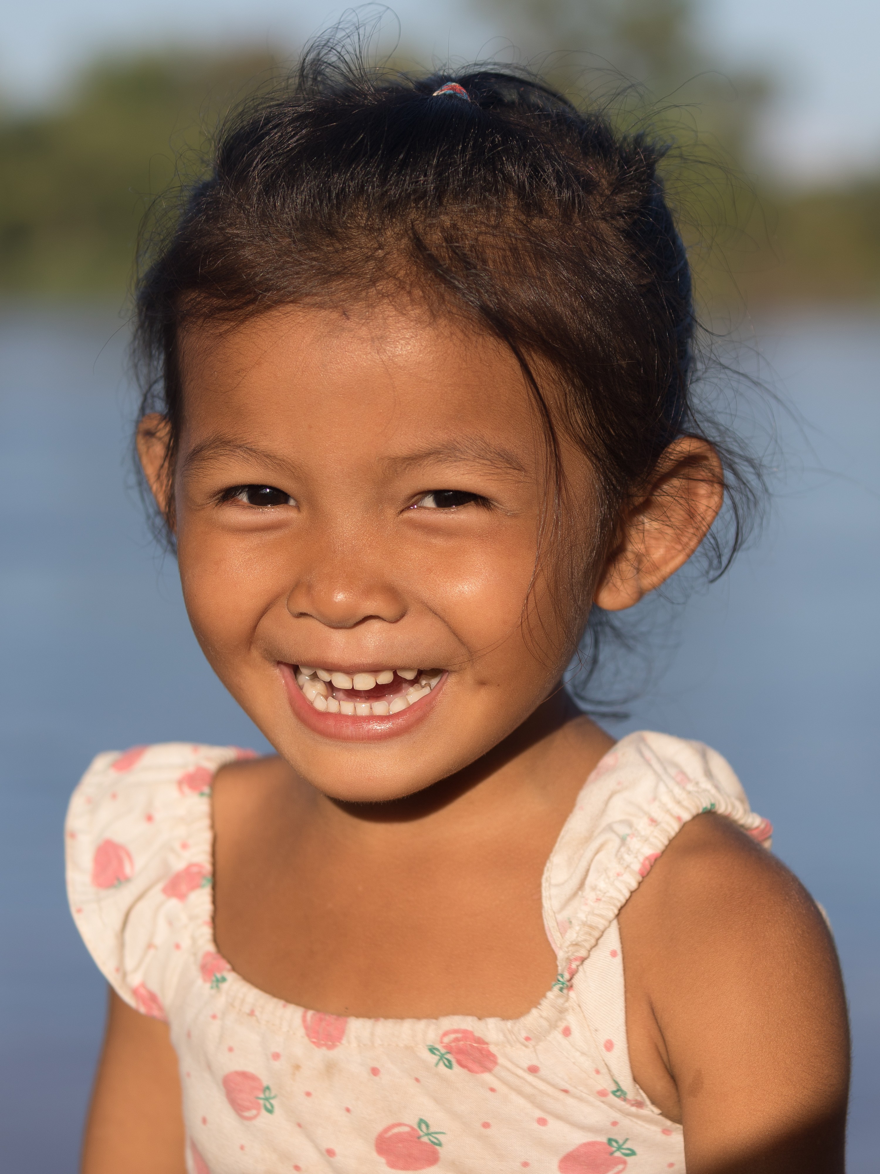Young girl laughing in sunshine