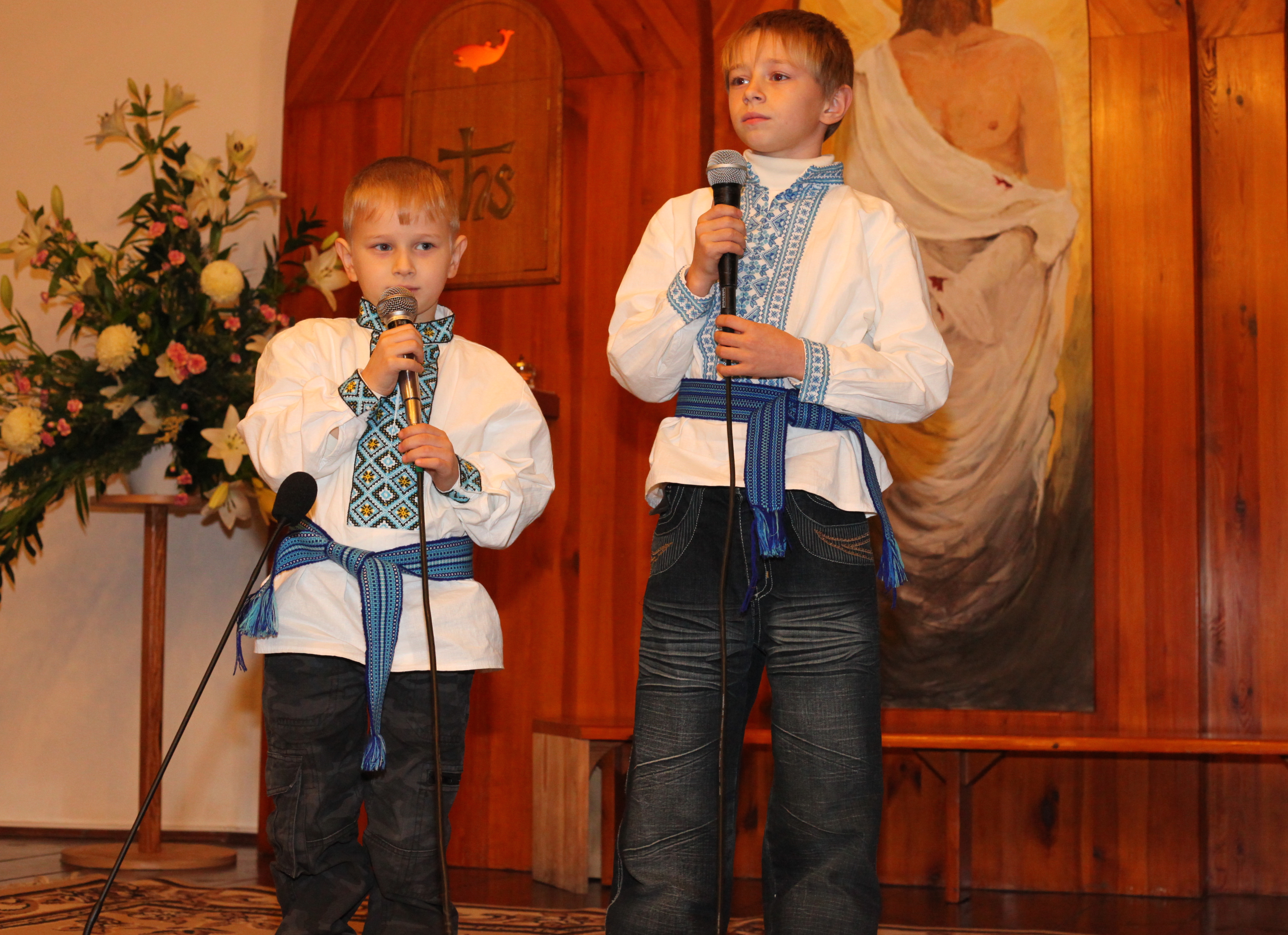 two Catholic boys performing in a Catholic kindergarten