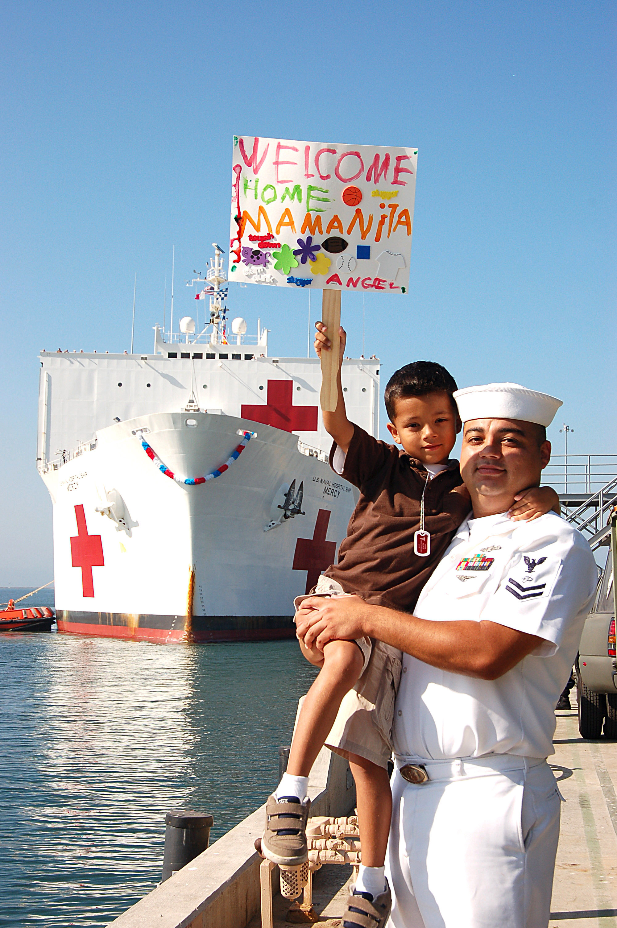 US Navy 080925-N-3570S-028 Electronic's Technician 2nd Class Jose Angel Alcala holds his six-year old son