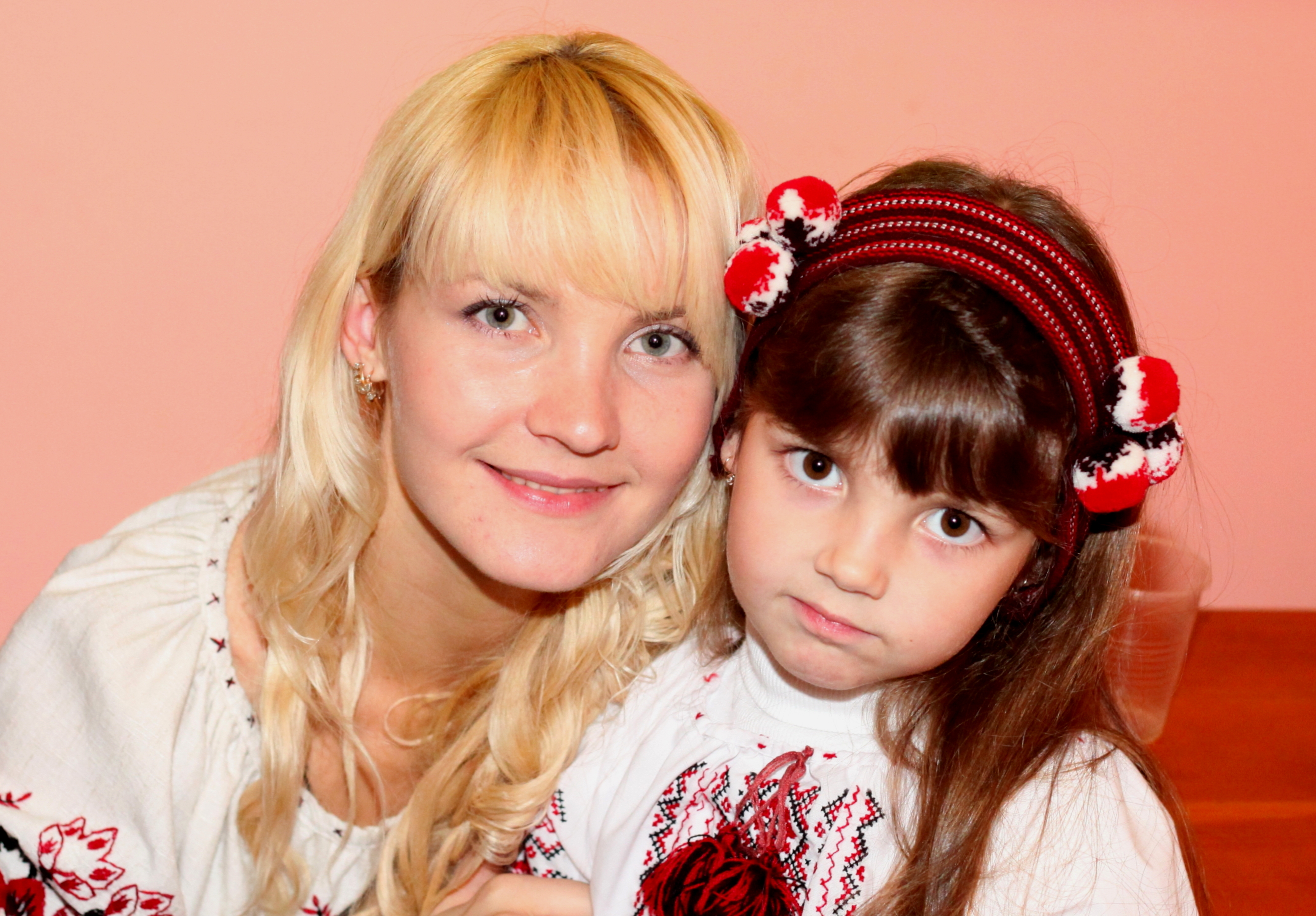 an amazingly tender and charming beautiful young blond Catholic woman with her daughter in a Church, photo 25