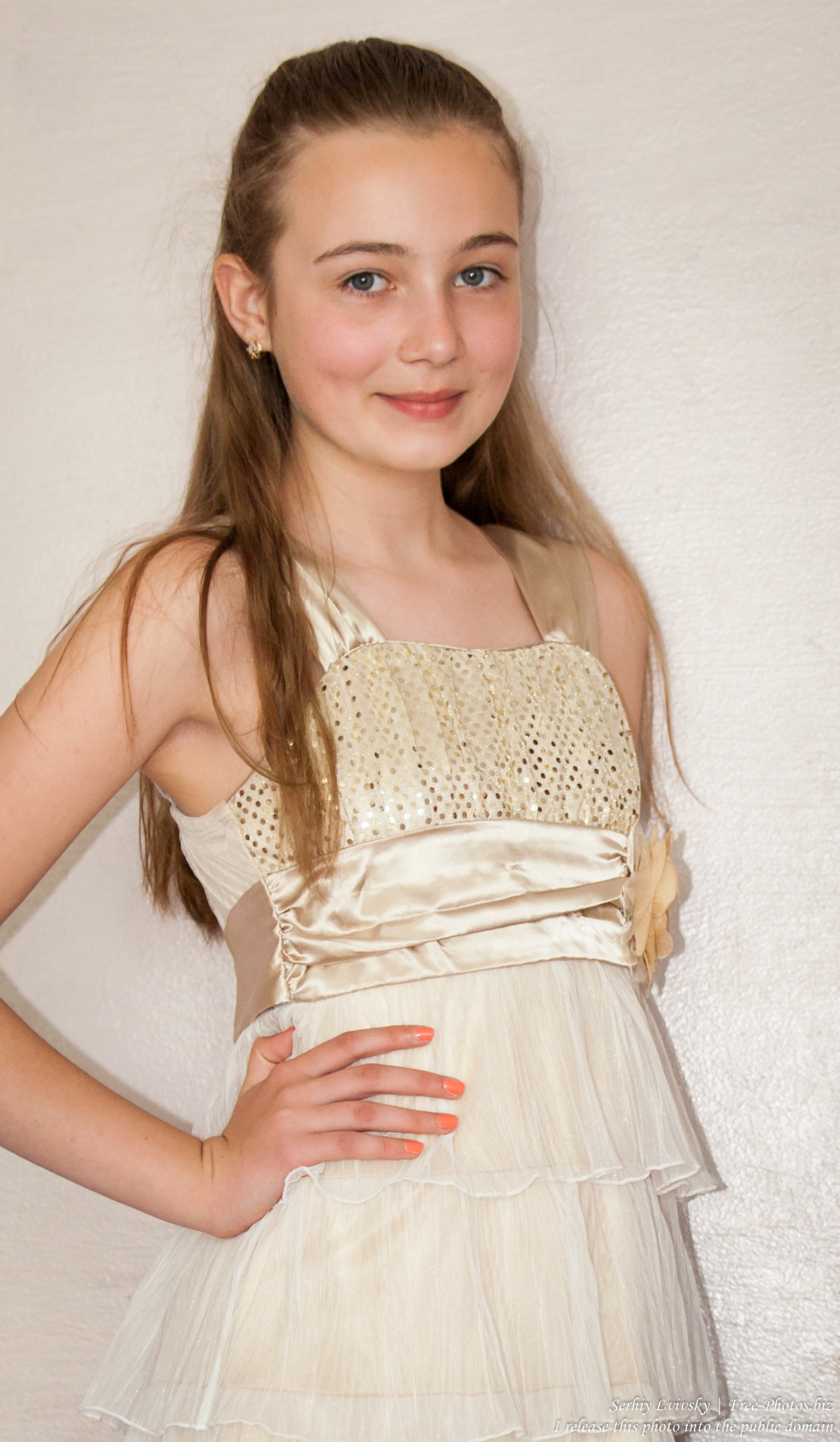 a beautiful schoolgirl wearing a dress photographed in June 2015, picture 12
