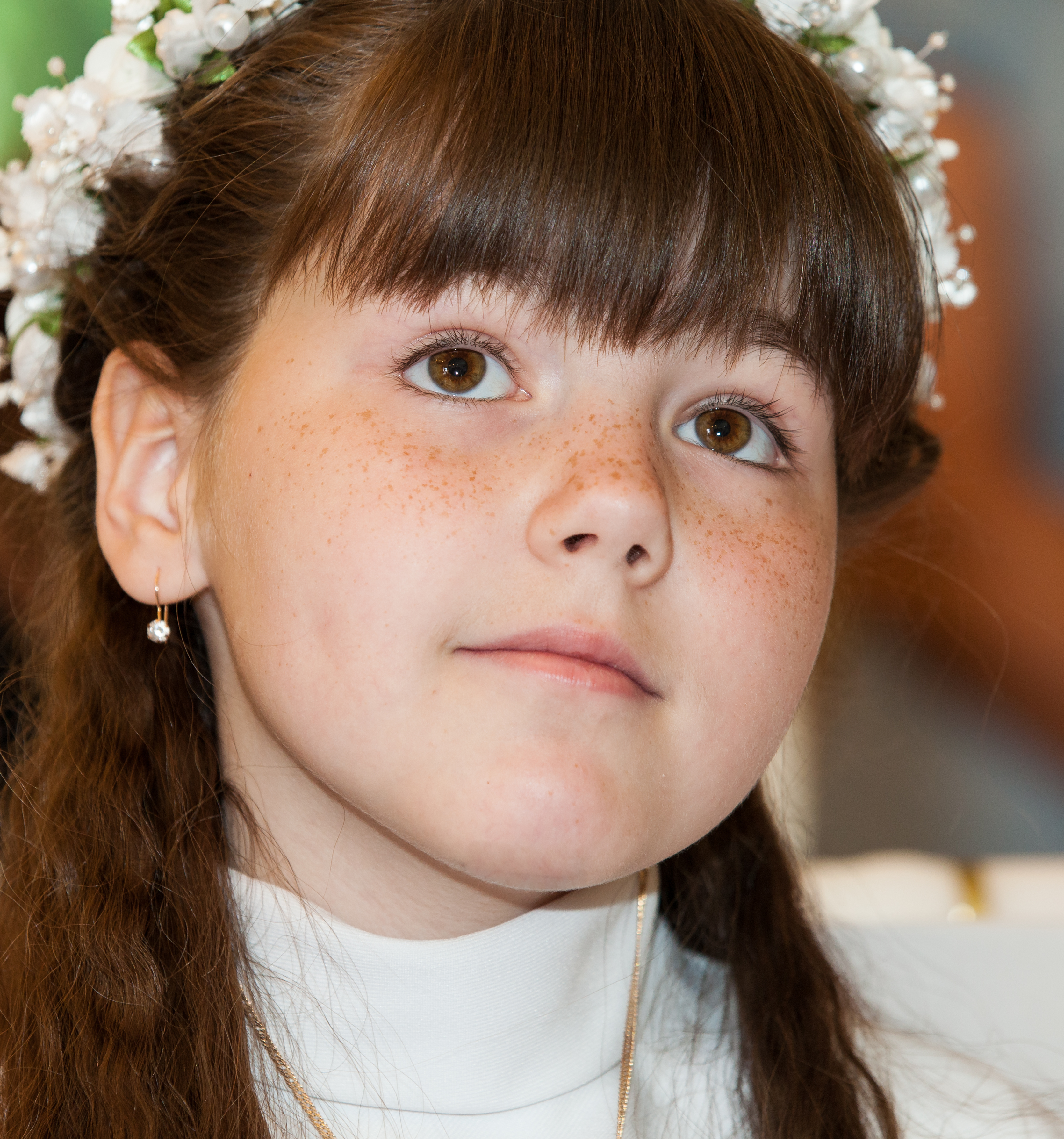 a Catholic child girl on her first Holy Communion Mass in June 2014, picture 3/4