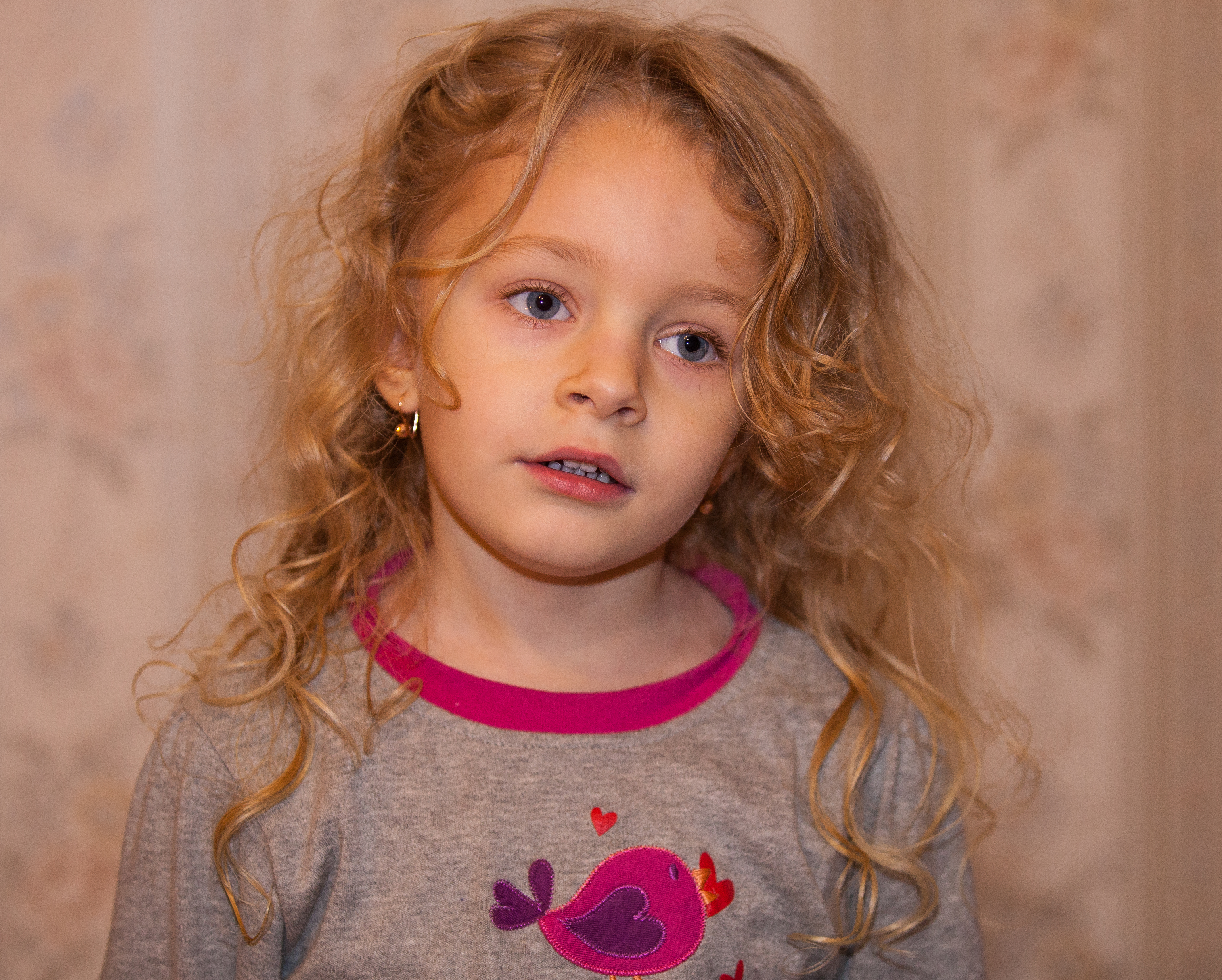 a cute blond child girl photographed in January 2014, photo 2 out of 4