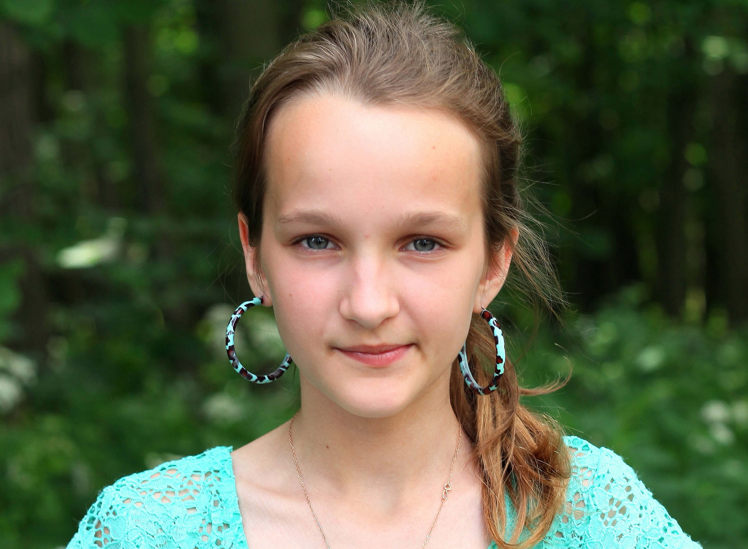 an absolutely beautiful girl with huge earrings, photographed in June 2013, portrait 15/27