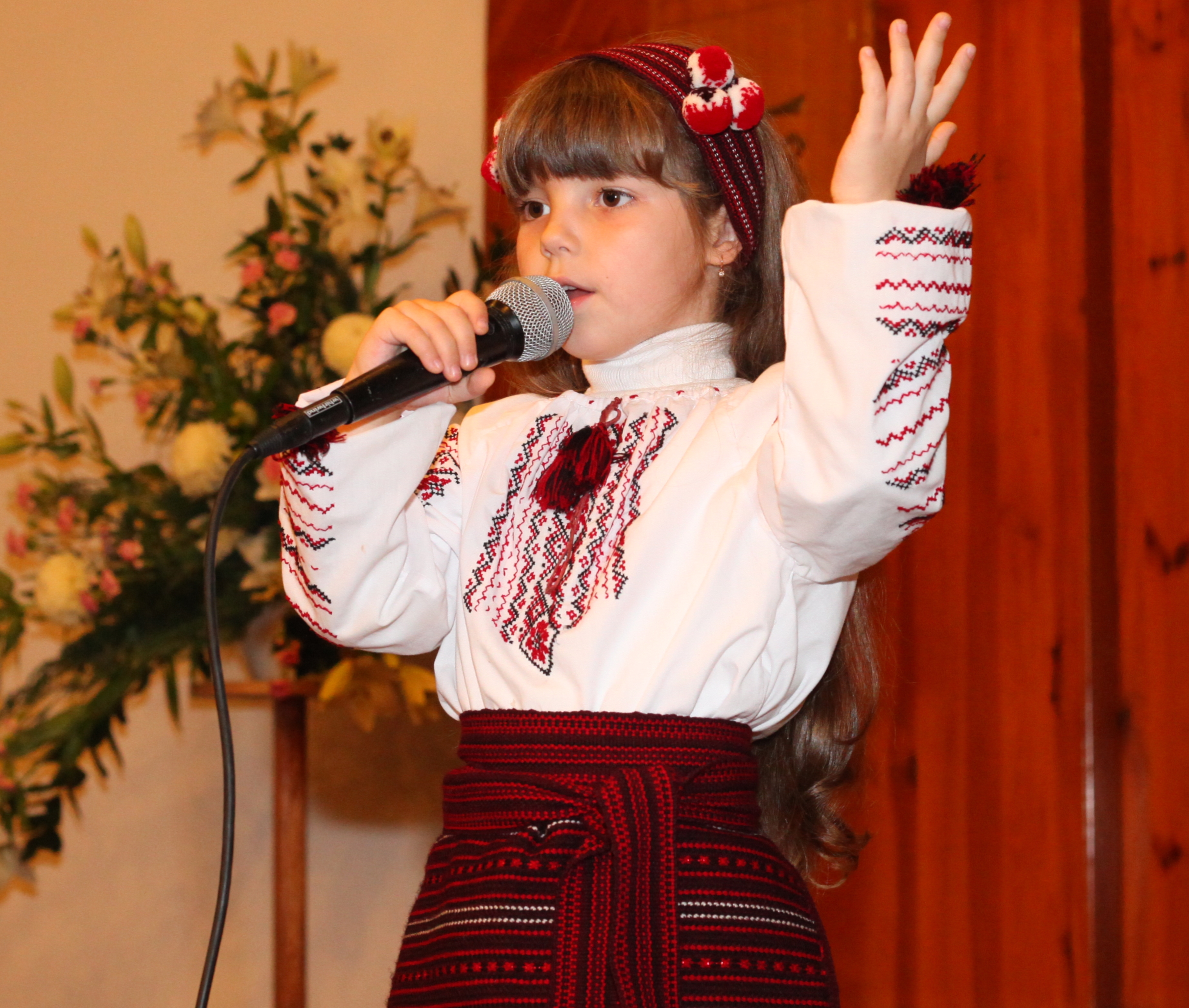 an amazingly cute brunette Catholic child girl performing in a Catholic kindergarten, photo 5