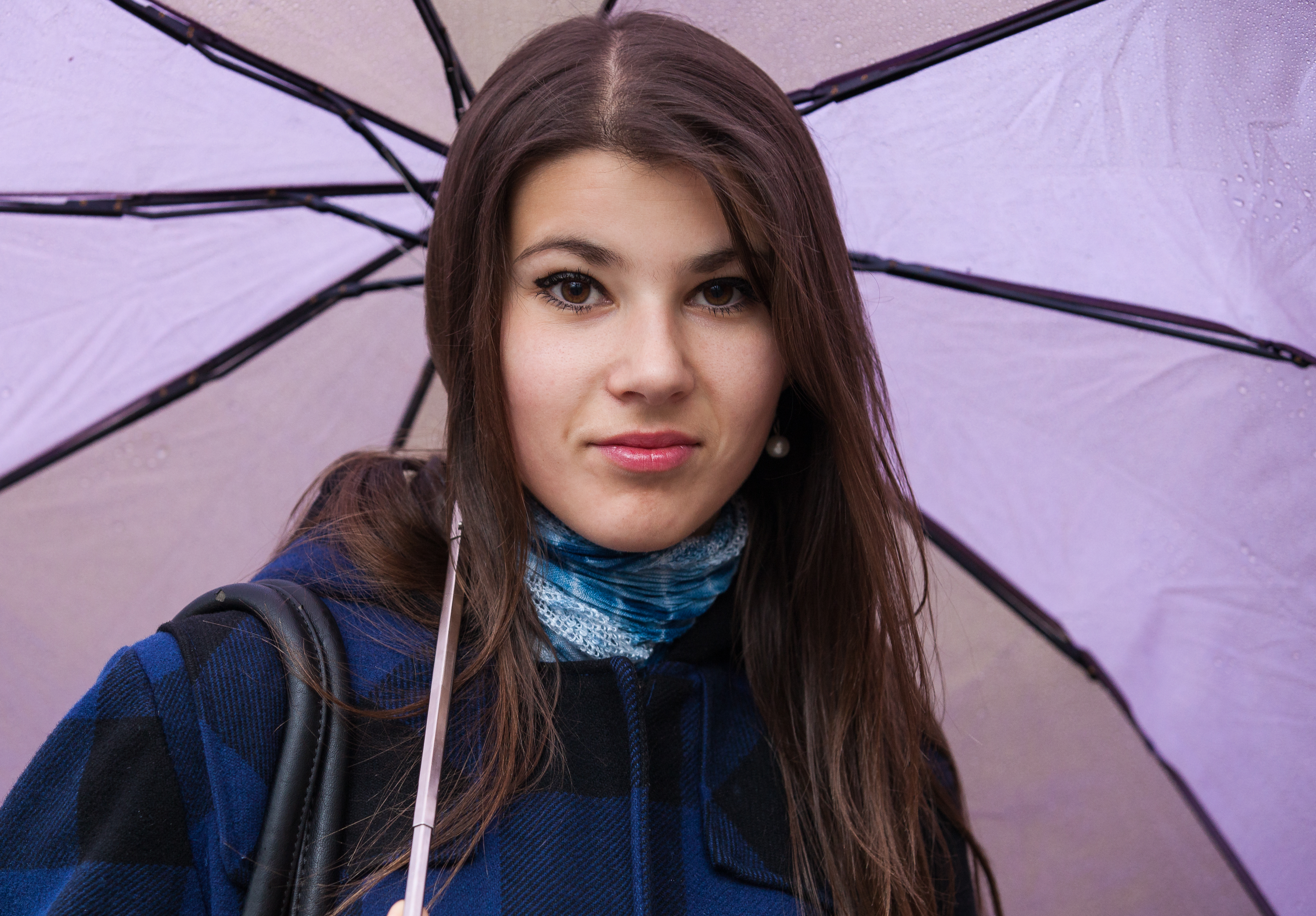 an exceptionally beautiful brunette Catholic girl holding an umbrella, photographed in November 2013, picture 1 out of 19