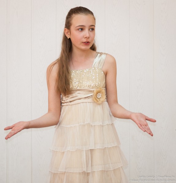 a beautiful schoolgirl wearing a dress photographed in June 2015, picture 3