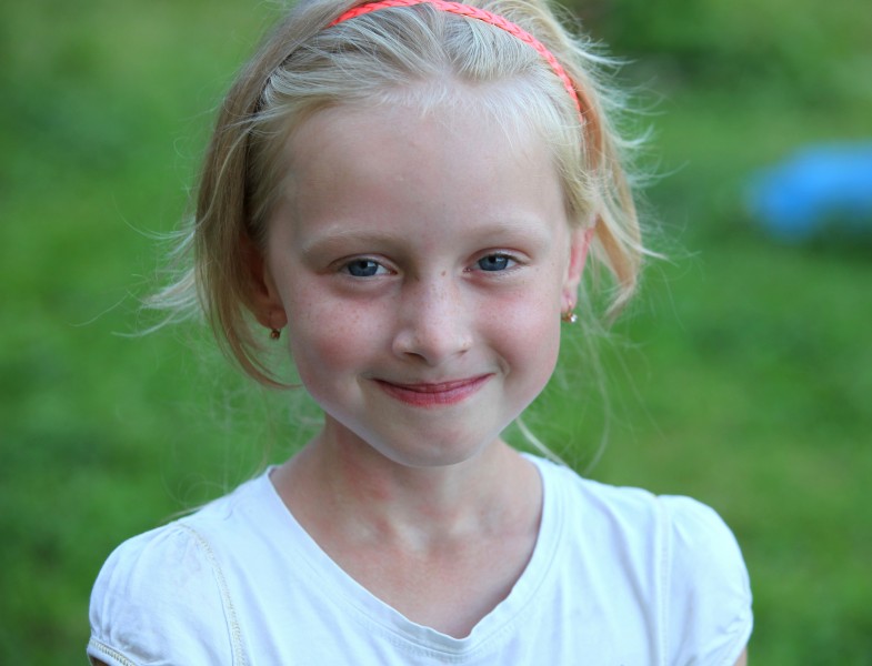 a cute young blond girl (a Catholic Christian) in a Christian camp in July 2013, picture 6/8