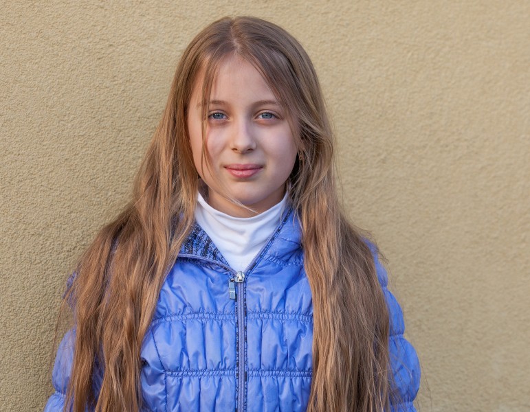 a blond long-haired Roman-Catholic girl photographed in April 2014, portrait 1 out of 11