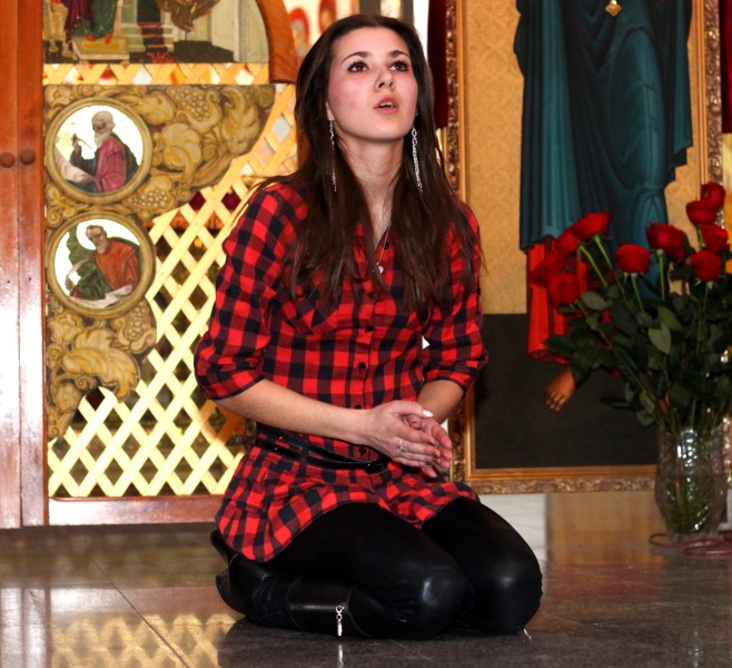 a brunette Catholic girl performing in a Church in April 2013, picture 1