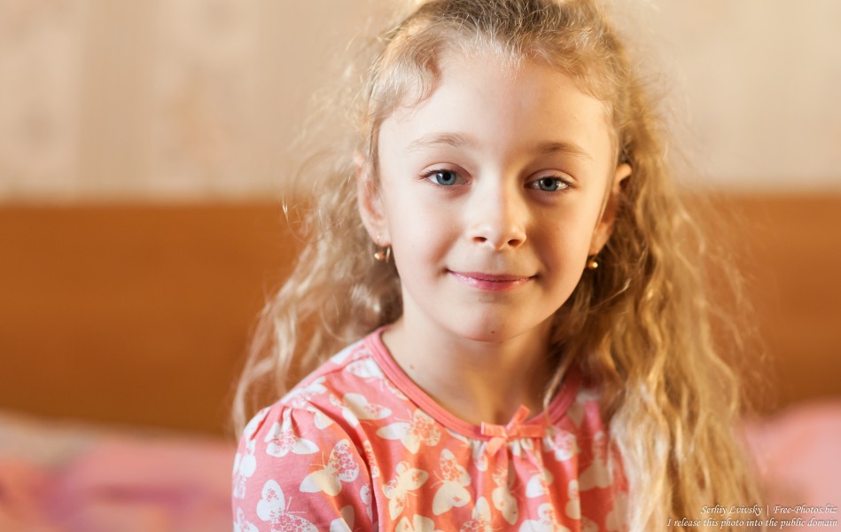 a cute blonde child girl photographed in March 2017, picture 2