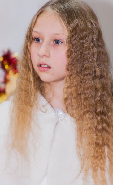 a young blond pretty schoolgirl photographed in December 2013, picture 5/6