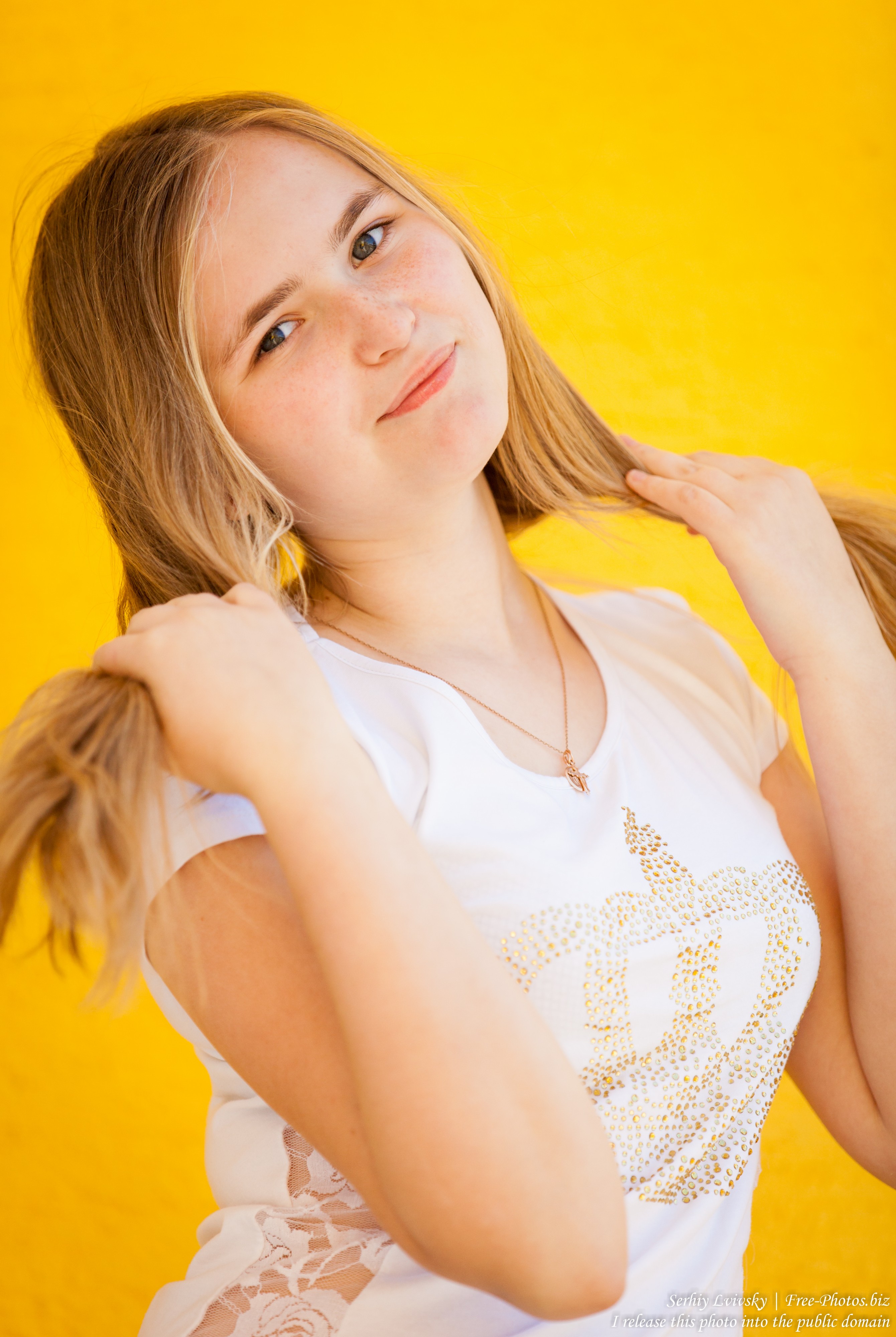 a 14-year old fair-haired girl photographed in June 2015, picture 3