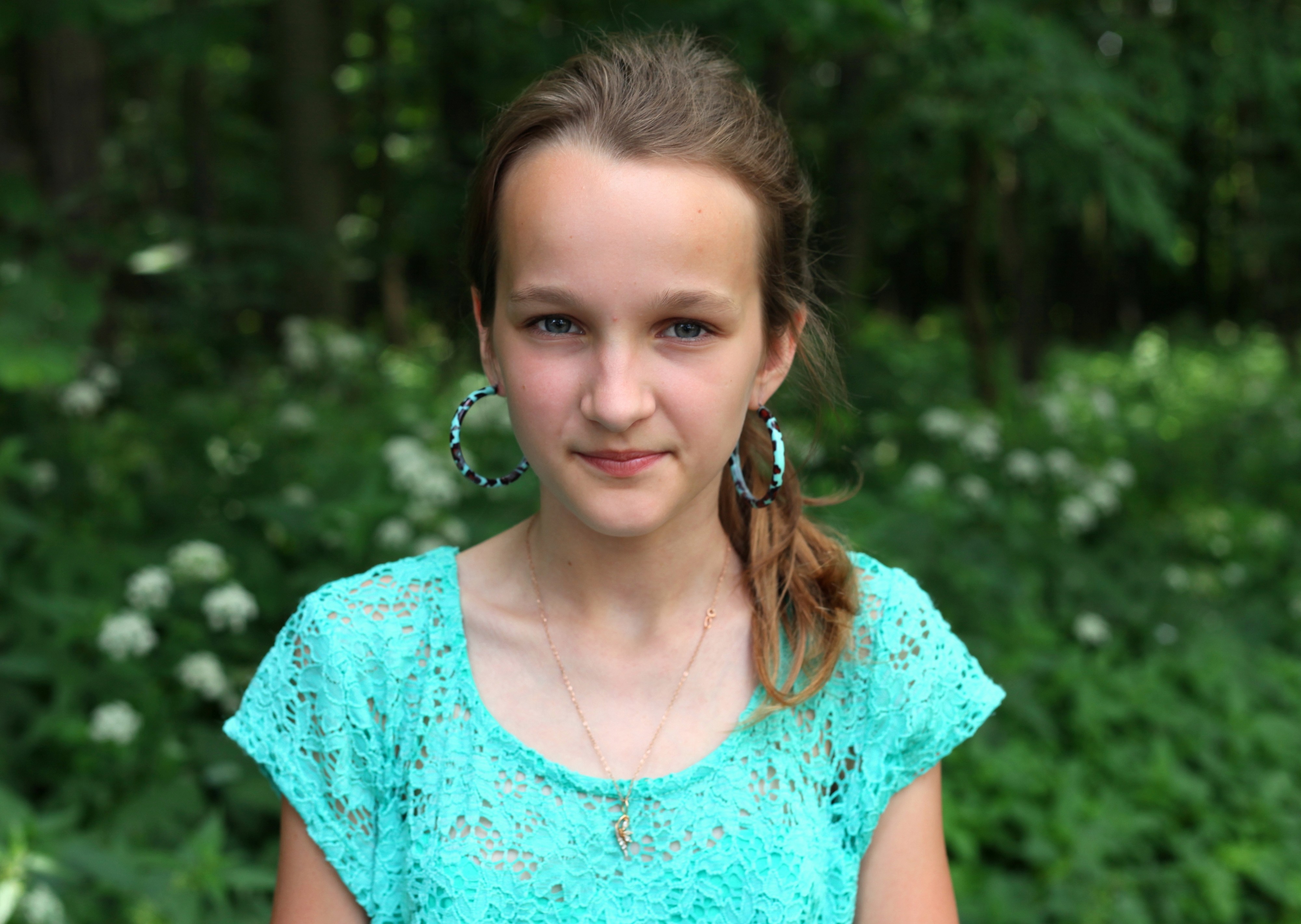 a pretty Catholic girl with huge earrings, photographed in June 2013, portrait 16/27