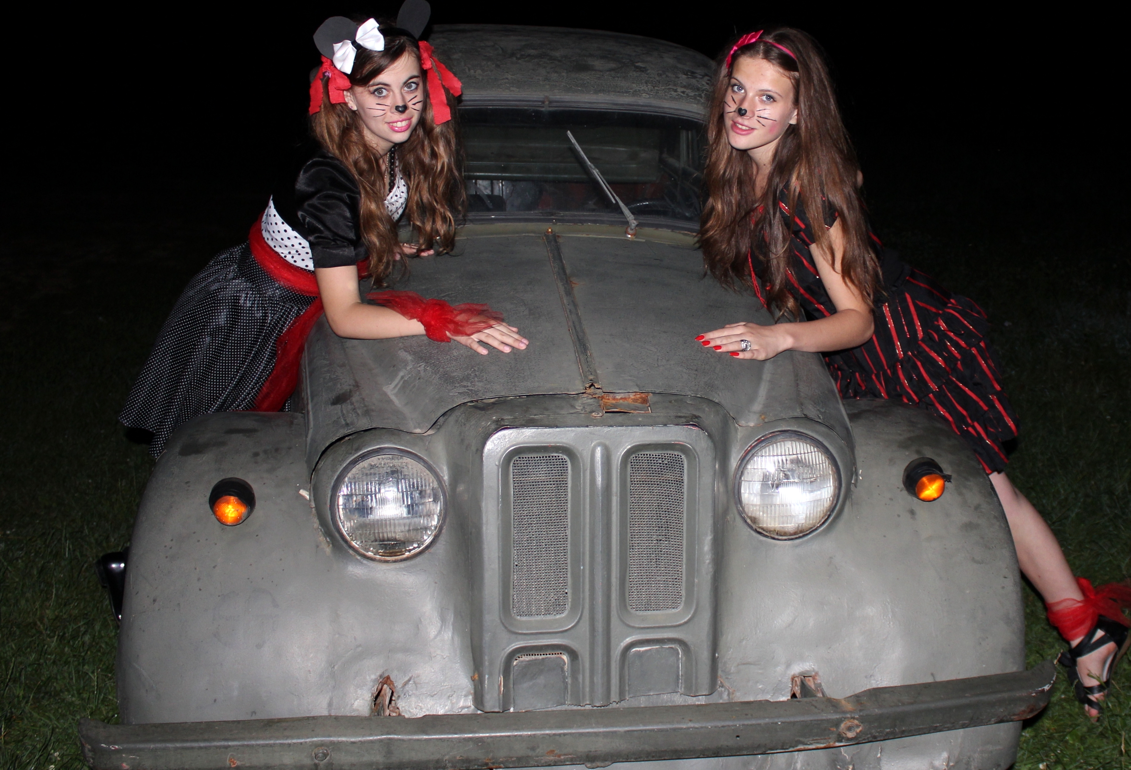 two fantastic charming beautiful brunette girls-animators in a Catholic camp on an ancient military car, photo 33
