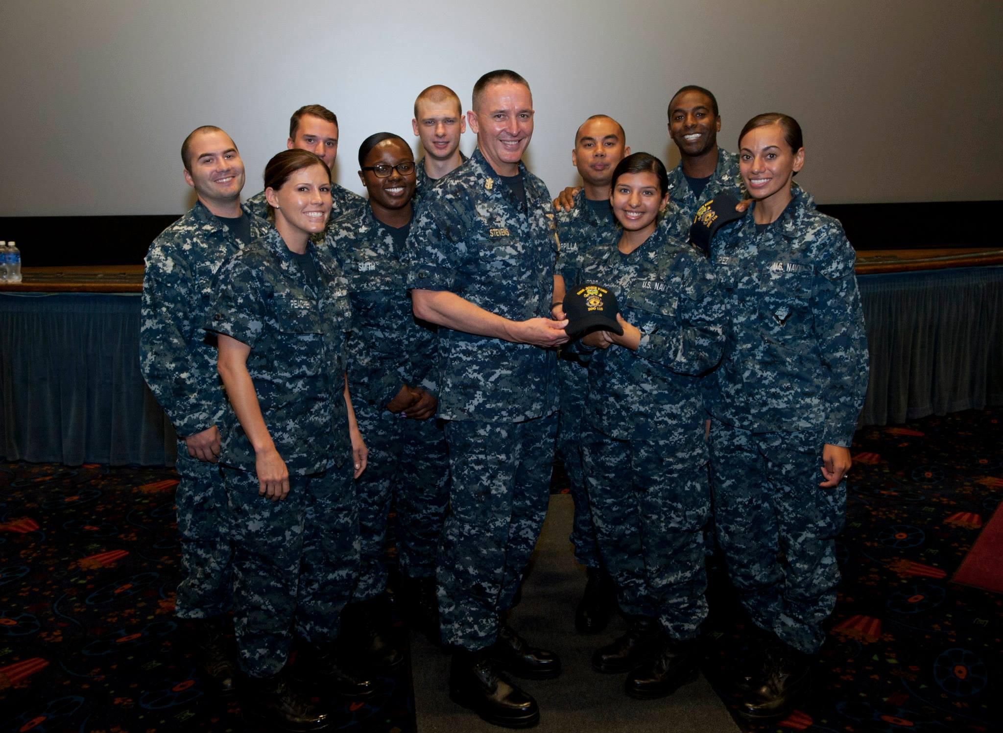150902-N-OT964-204 Mike Stevens takes photo with sailors