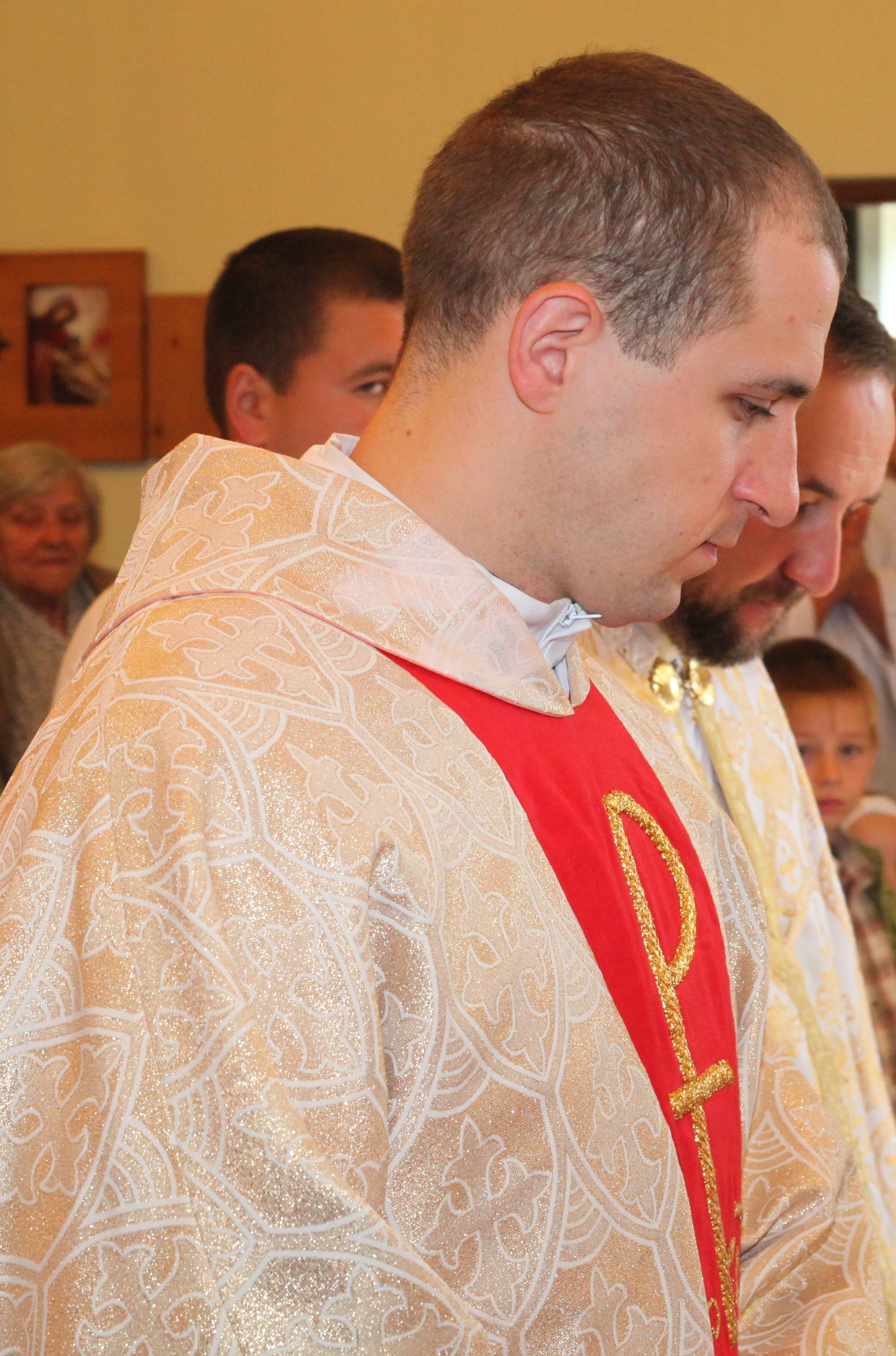 a young Catholic priest in a Church, photo 1
