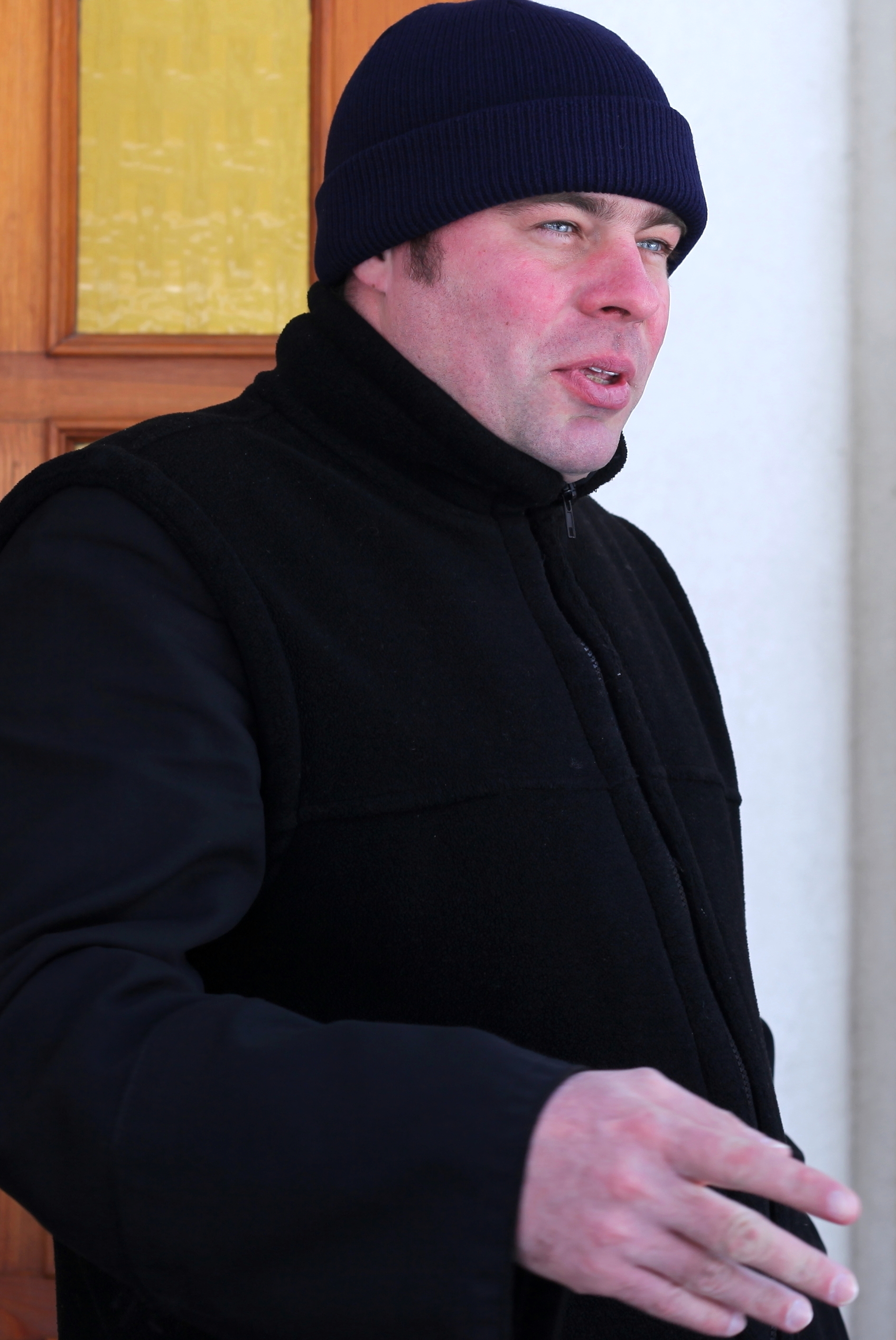 a handsome Catholic man near a Church