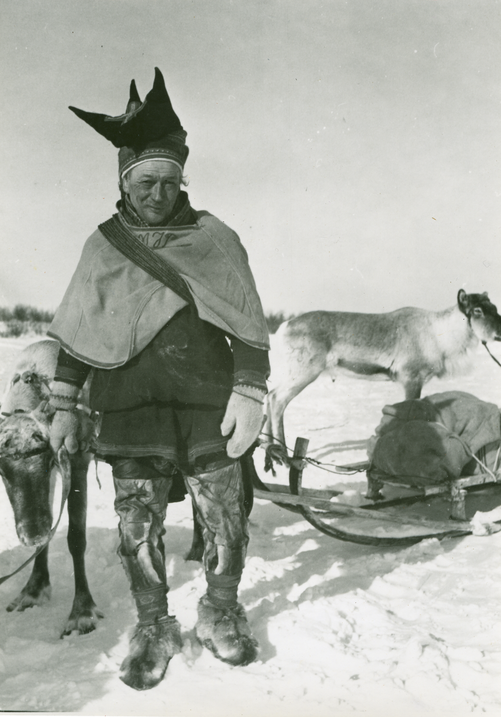 A man with two reindeer, Winter, Finnmarksvidda.
