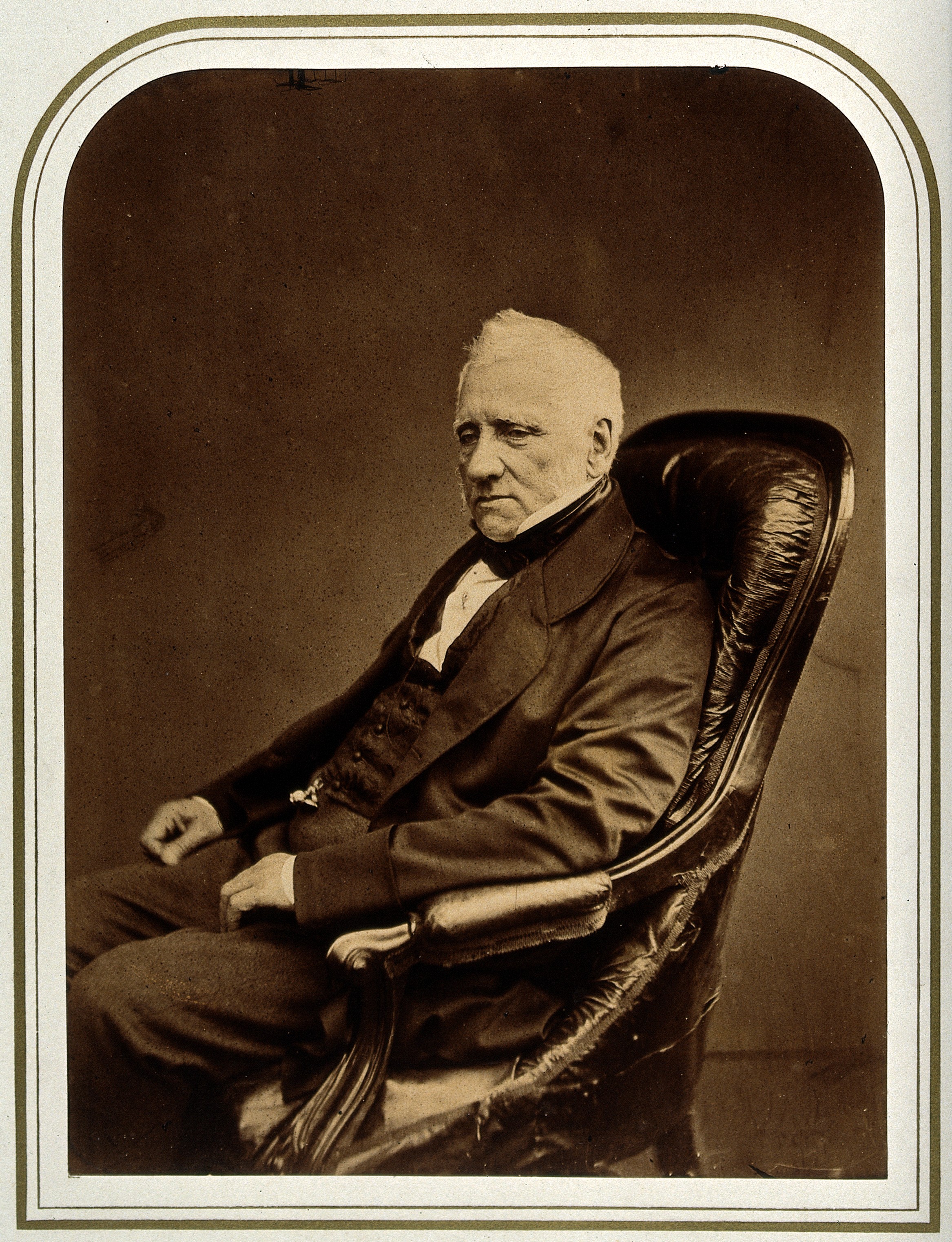An unidentified man in an armchair. Photograph attributed to Wellcome V0027581