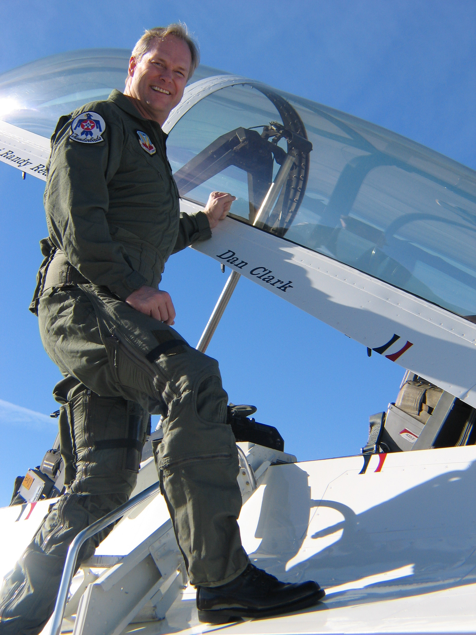 Dan Clark in a flight suit on a jet fighter