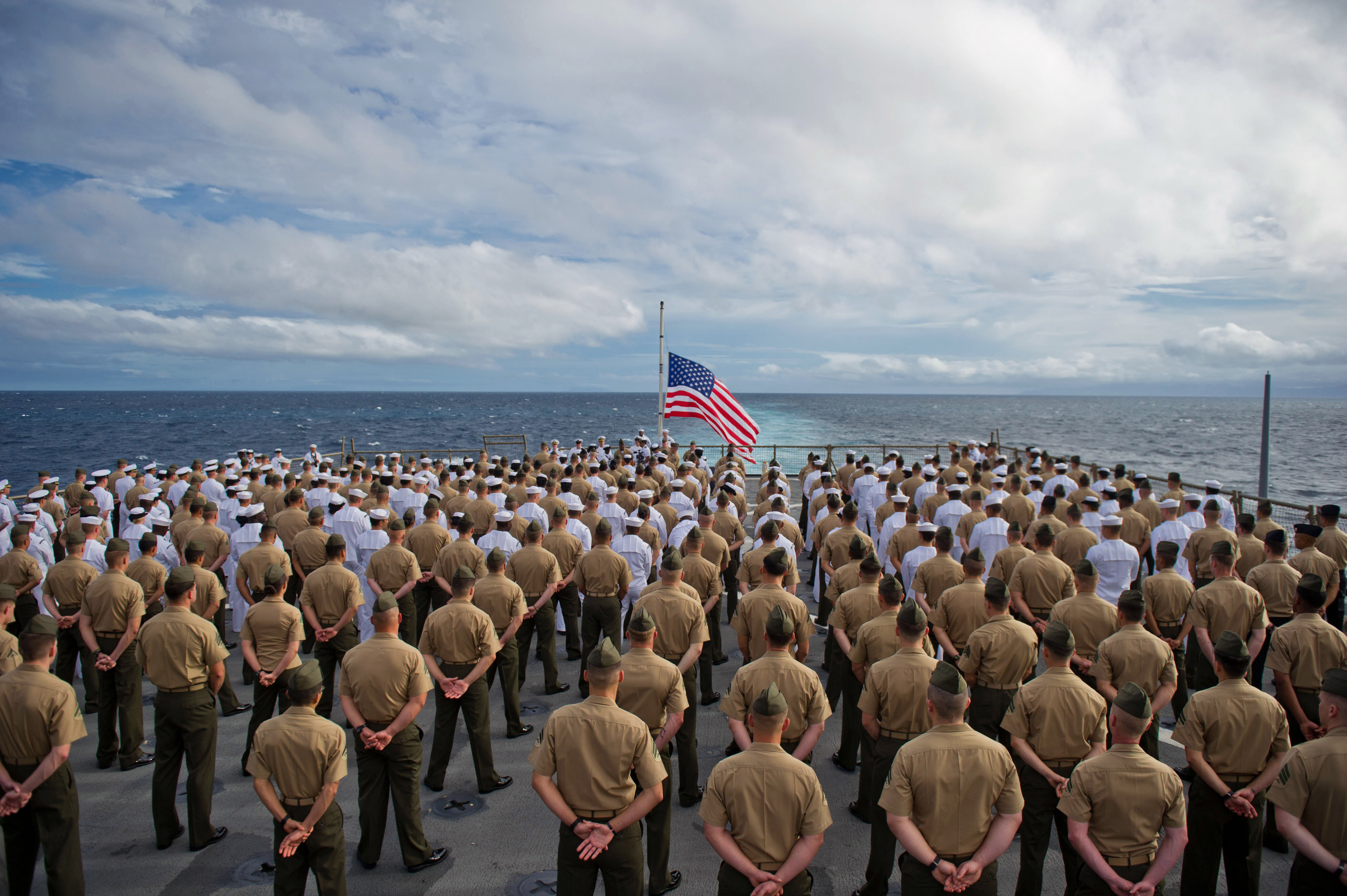 Defense.gov News Photo 111207-M-IS773-005 - Marines with the 11th Marine Expeditionary Unit and sailors aboard the USS Pearl Harbor LSD 52 stand in formation during a 70th anniversary