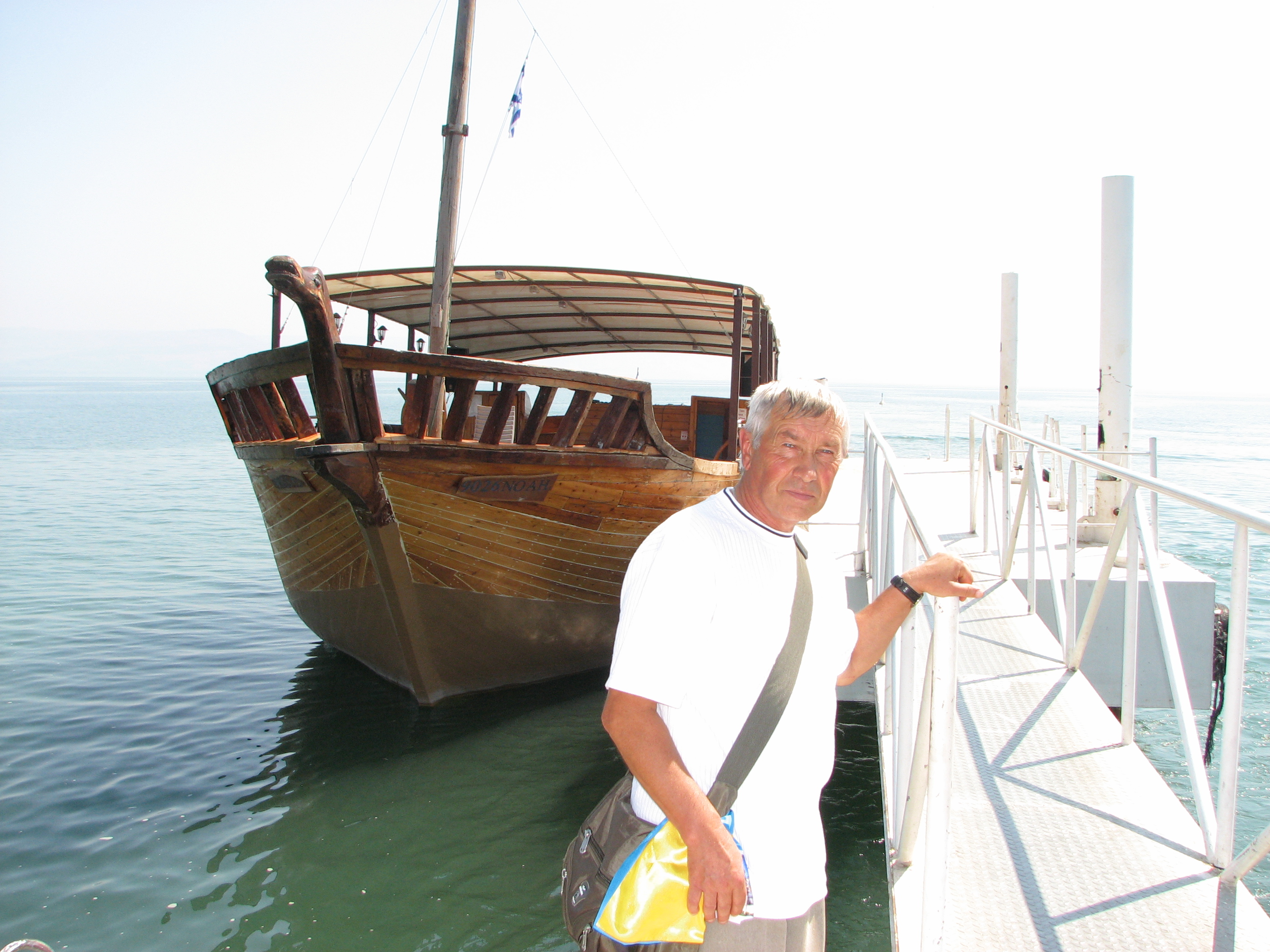 A pilgrim near a boat on the Galilean Sea (Lake) in Israel (where Jesus Christ preached), picture 16