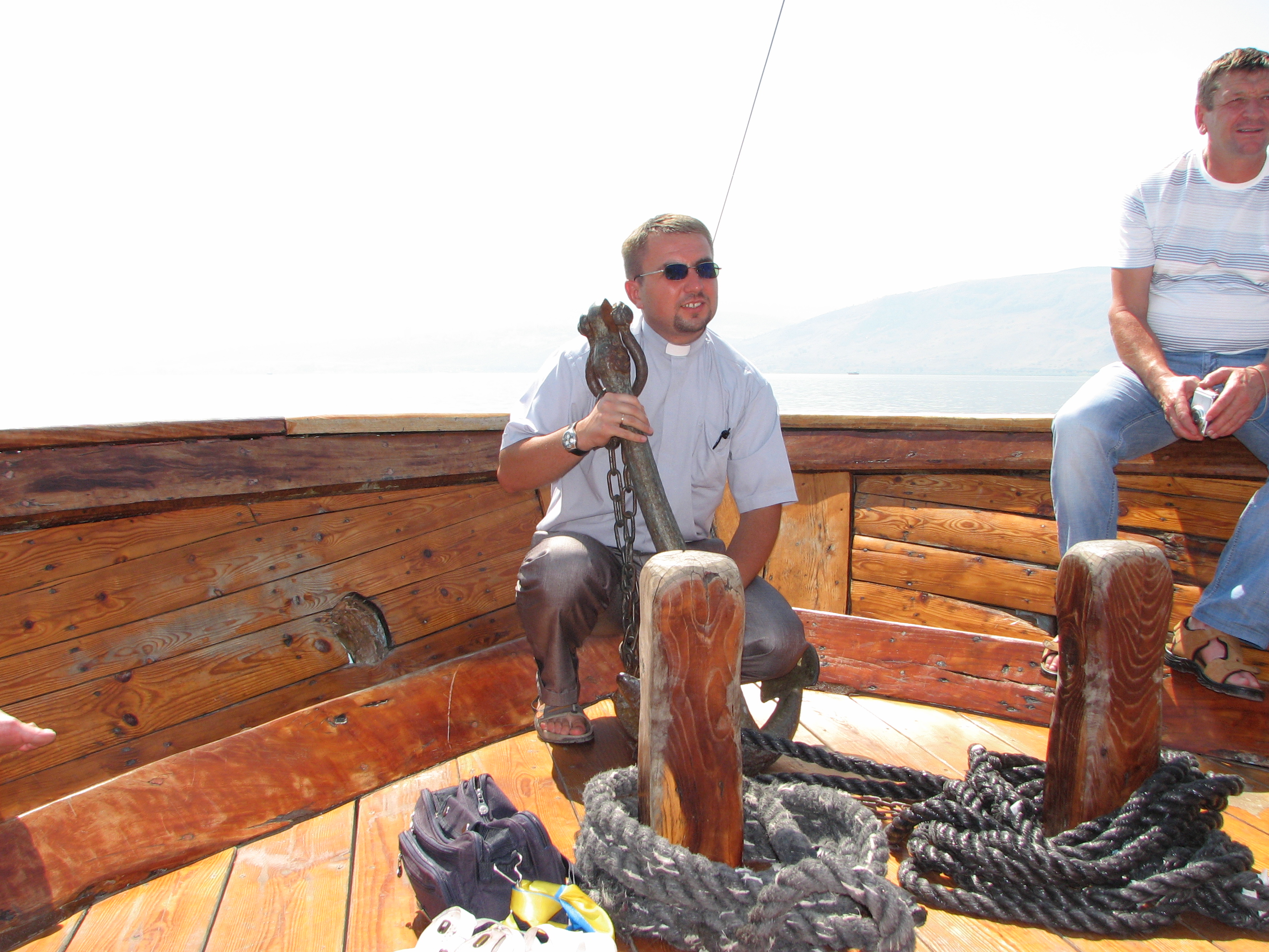 A Catholic priest on a boat on the Galilean Sea (Lake) in Israel (where Jesus Christ preached), picture 5