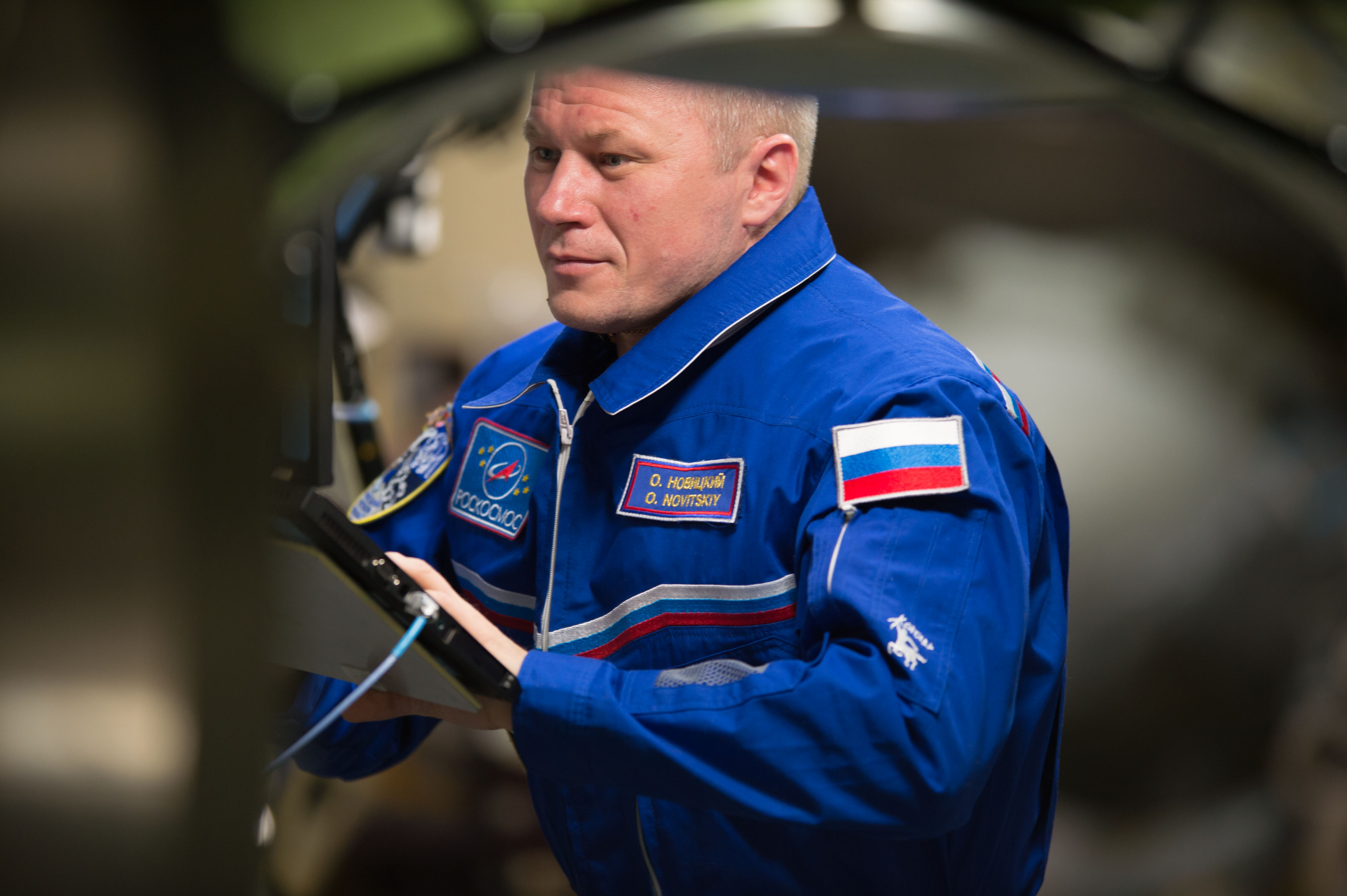 ISS-50 Oleg Novitskiy wearing a flight suit aboard the ISS