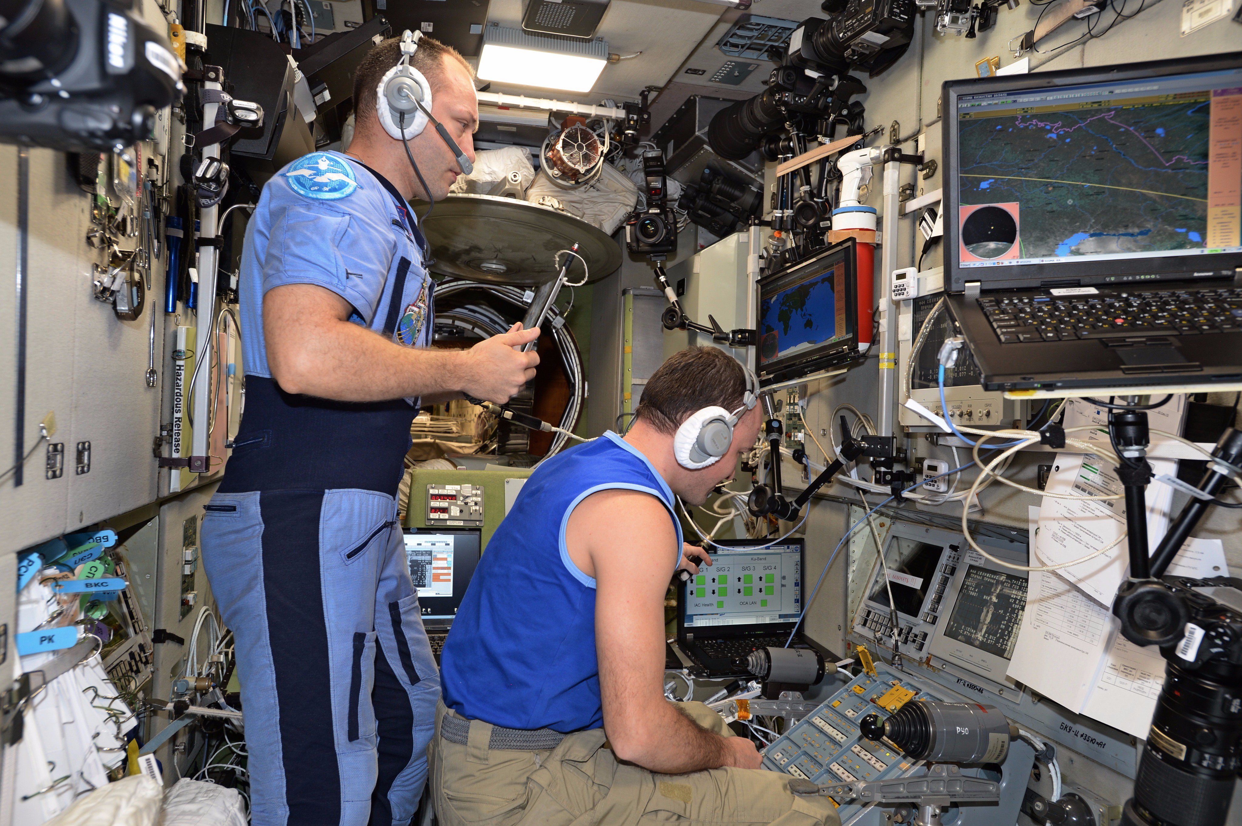 ISS-53 Aleksandr Misurkin and Sergey Ryazansky monitor the docking of Progress MS-07
