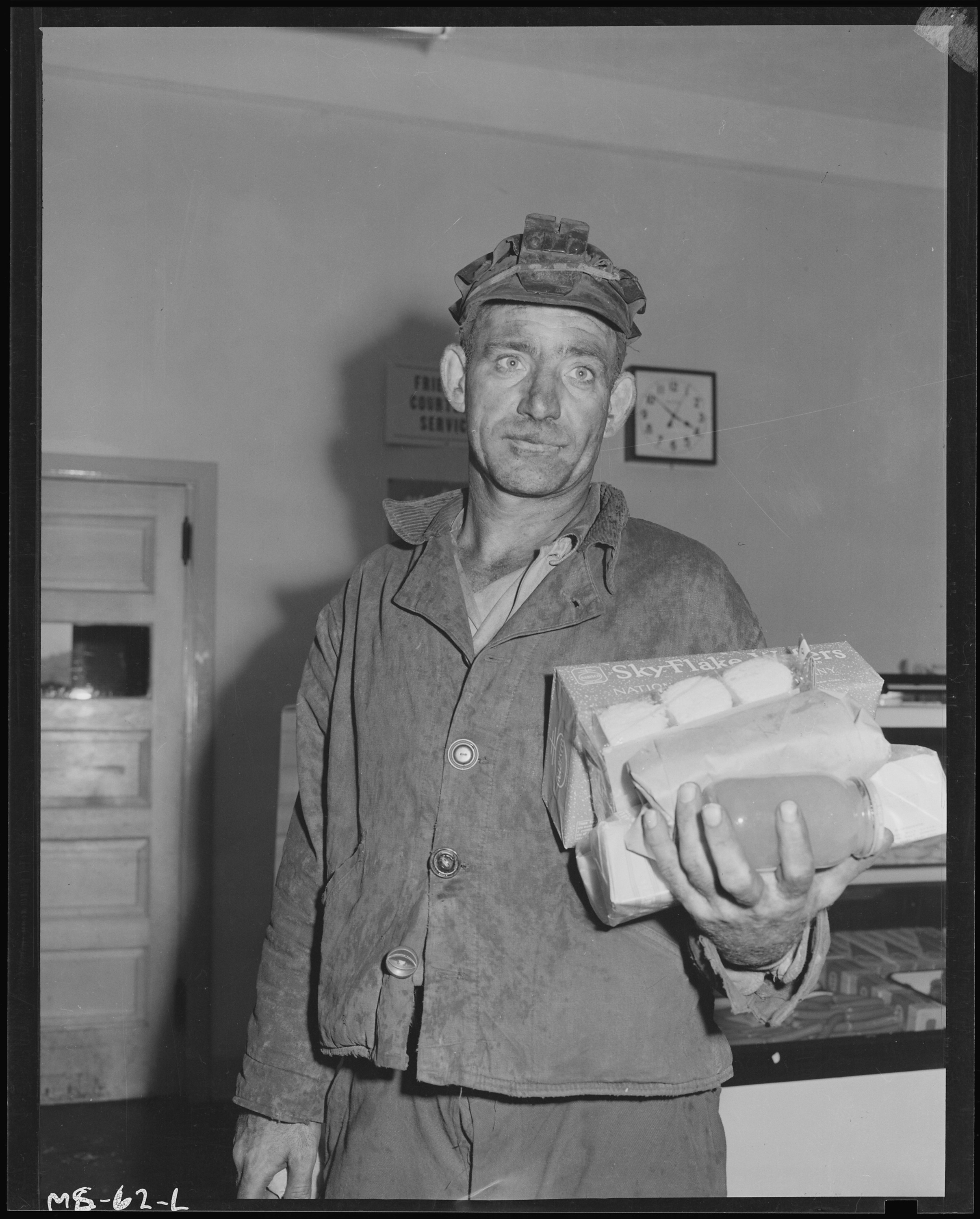 Louis Shafer, miner, with armful of groceries bought at company store. Pittsburgh Coal Company, Westland Mine... - NARA - 540250