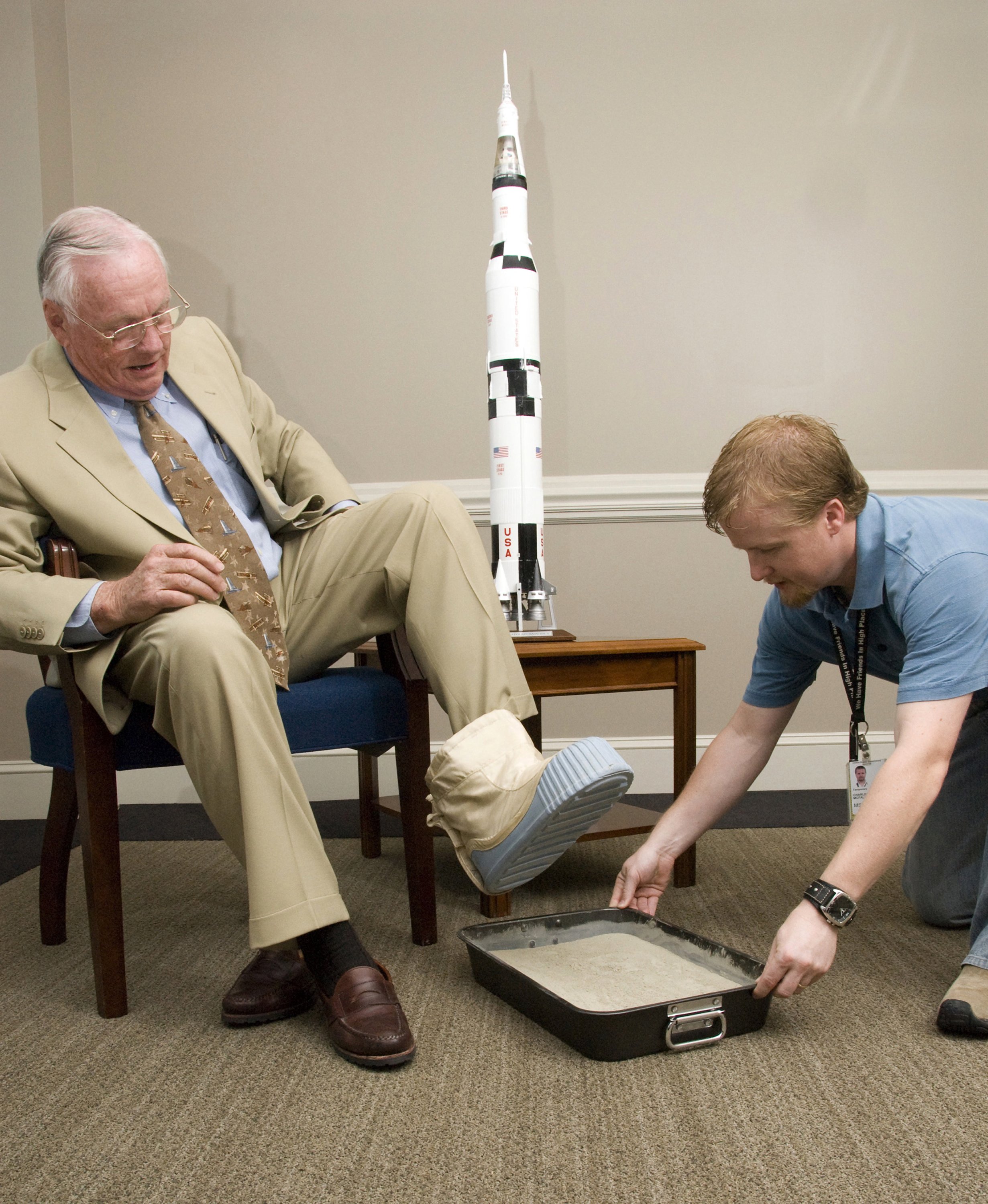 Neil Armstrong casts his footprint