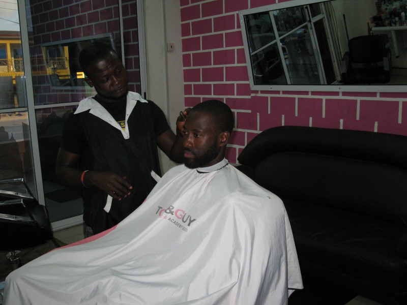 A Ghanaian Barber in his shop