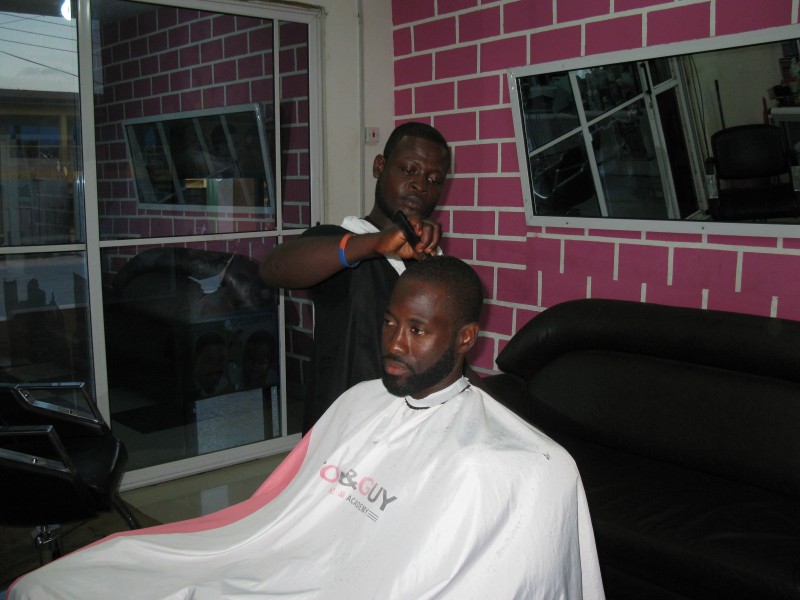 A Ghanaian Barber working