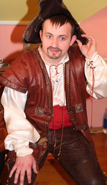a handsome Catholic man dressed up as a pirate