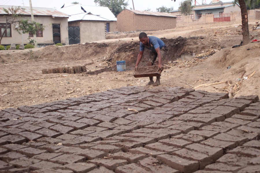 A man making mud blocks